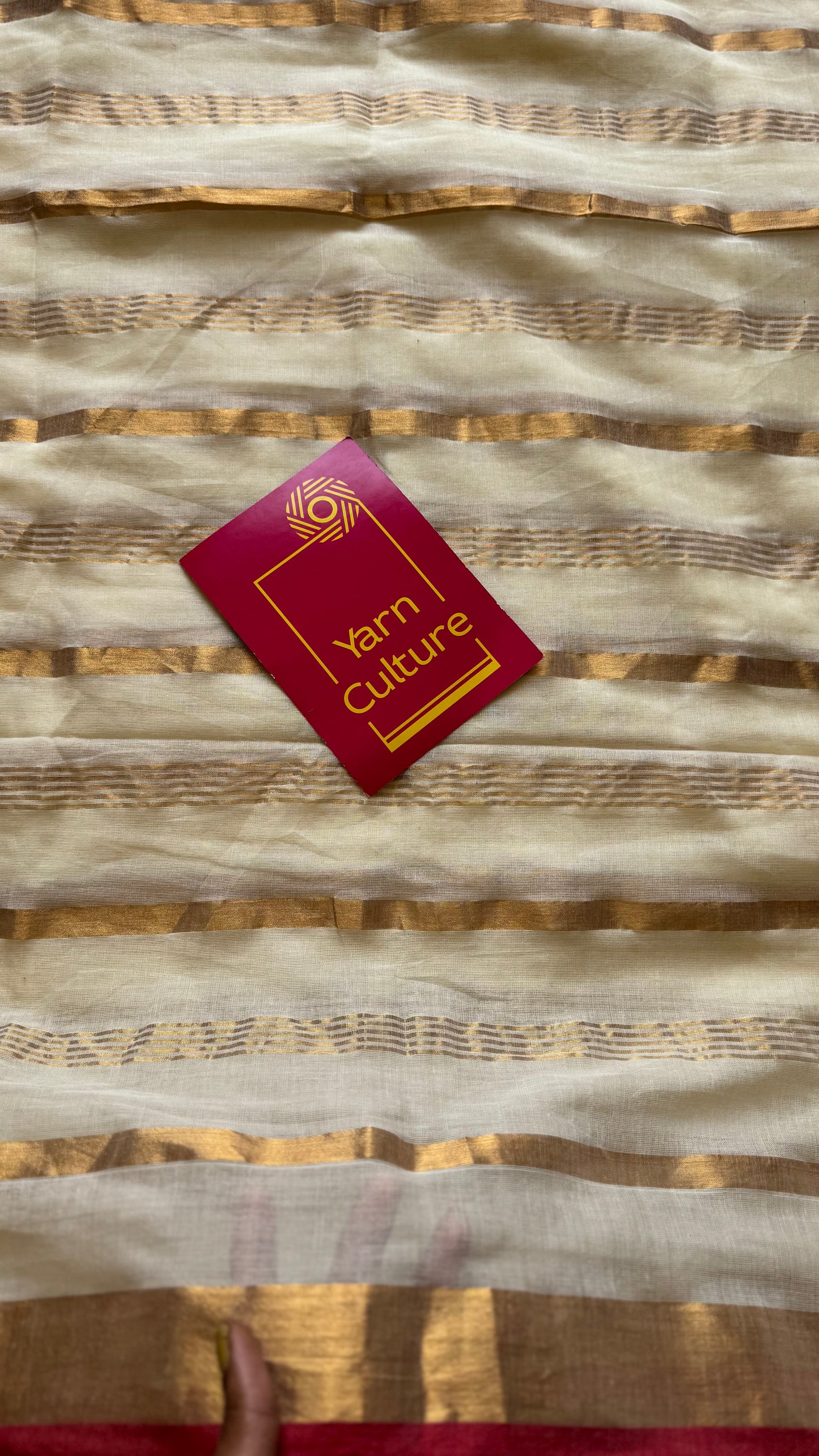 Ivory mul saree with gold stripes and red border - YCIEBCFE327