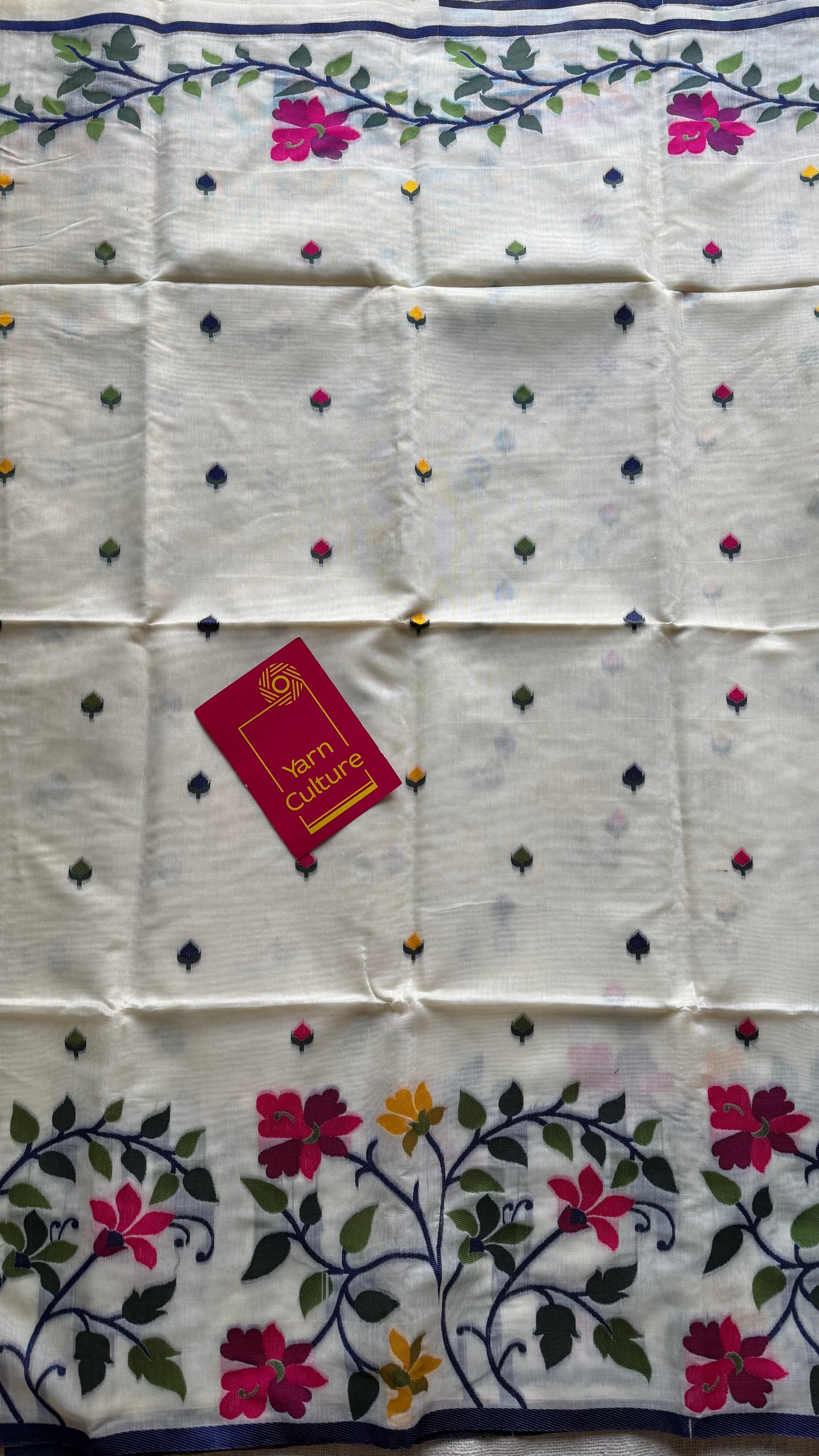 Ivory with navy blue border and multicolour floral motifs, cotton saree - YCIEBCFE325