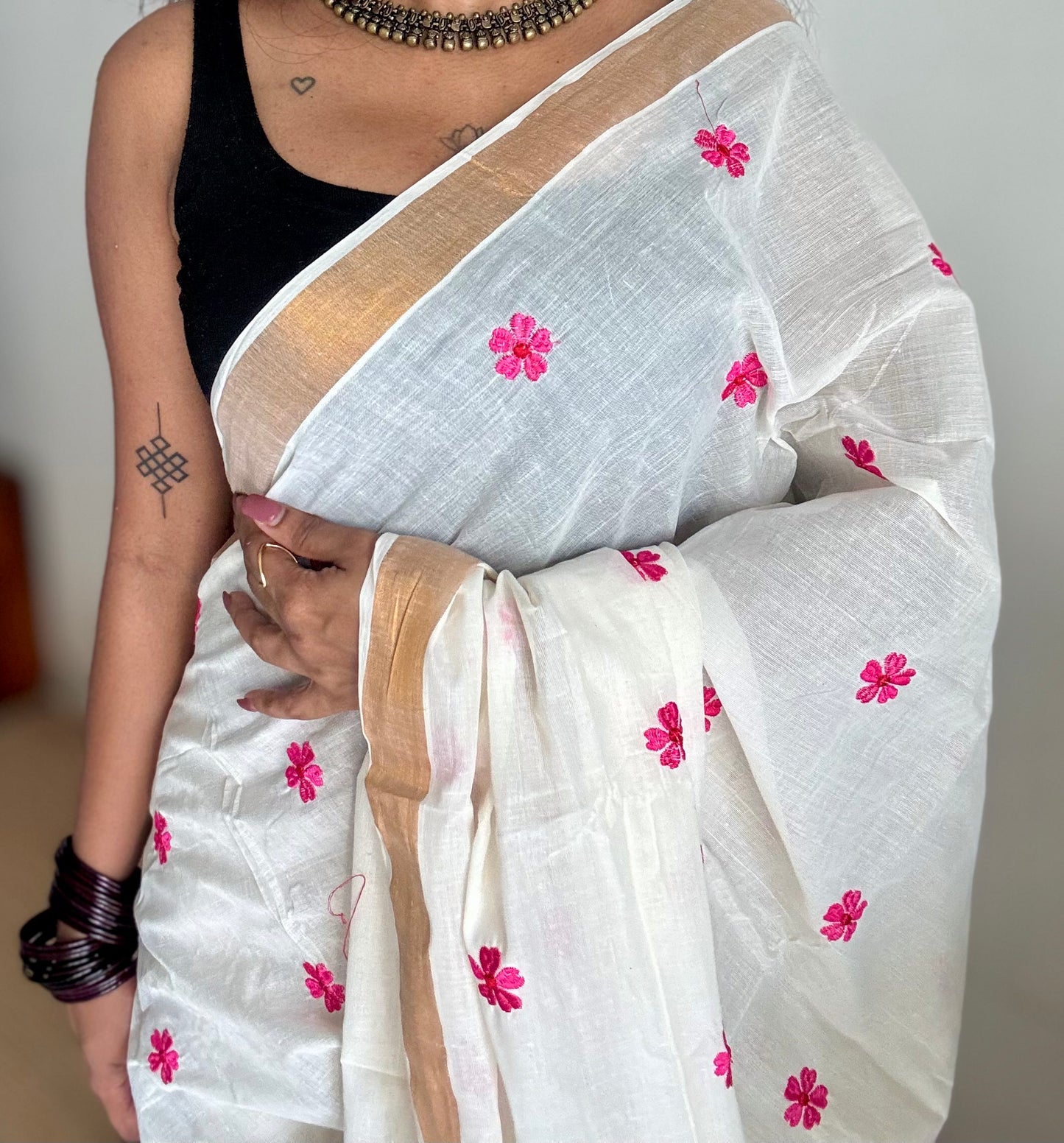 Ivory and antique gold soft cotton kasavu saree, pink parijat floral embroidery - YCIEON155