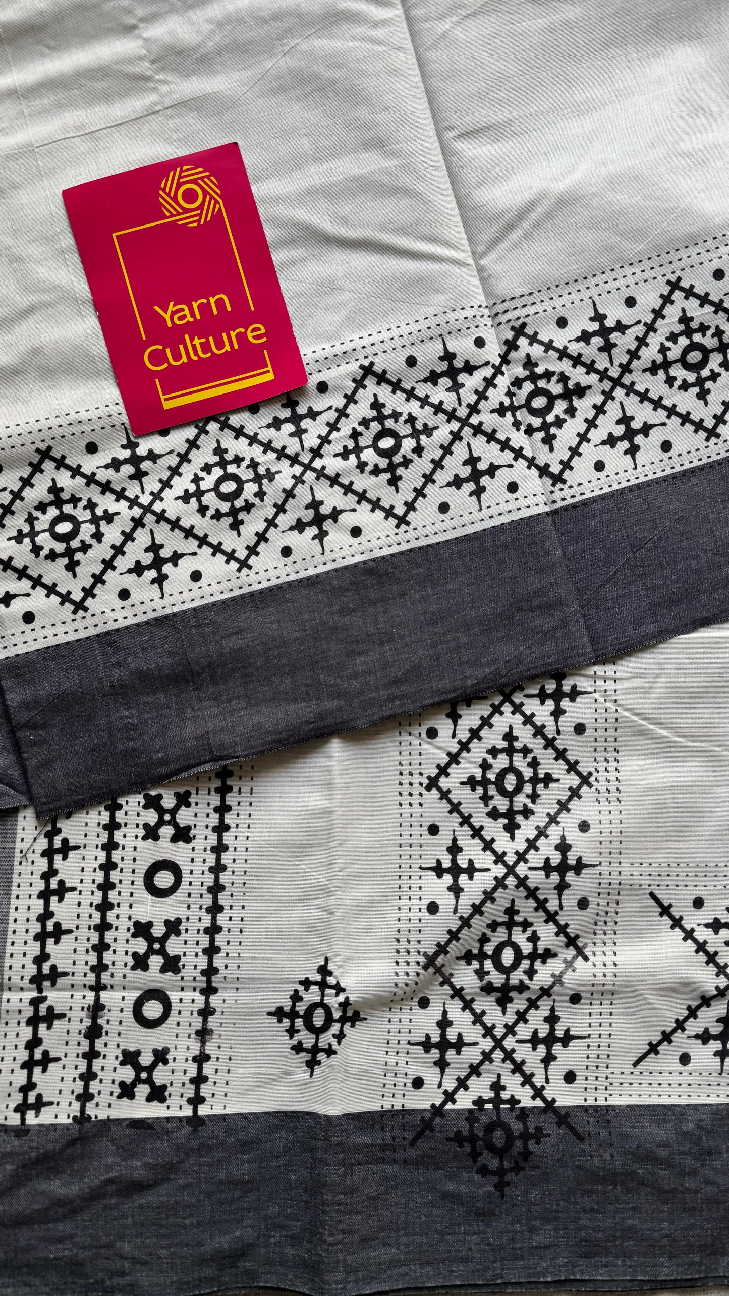 Ivory Kerala cotton saree with black Kutch-inspired printed borders and black centre pleats - YCIEKCFE312