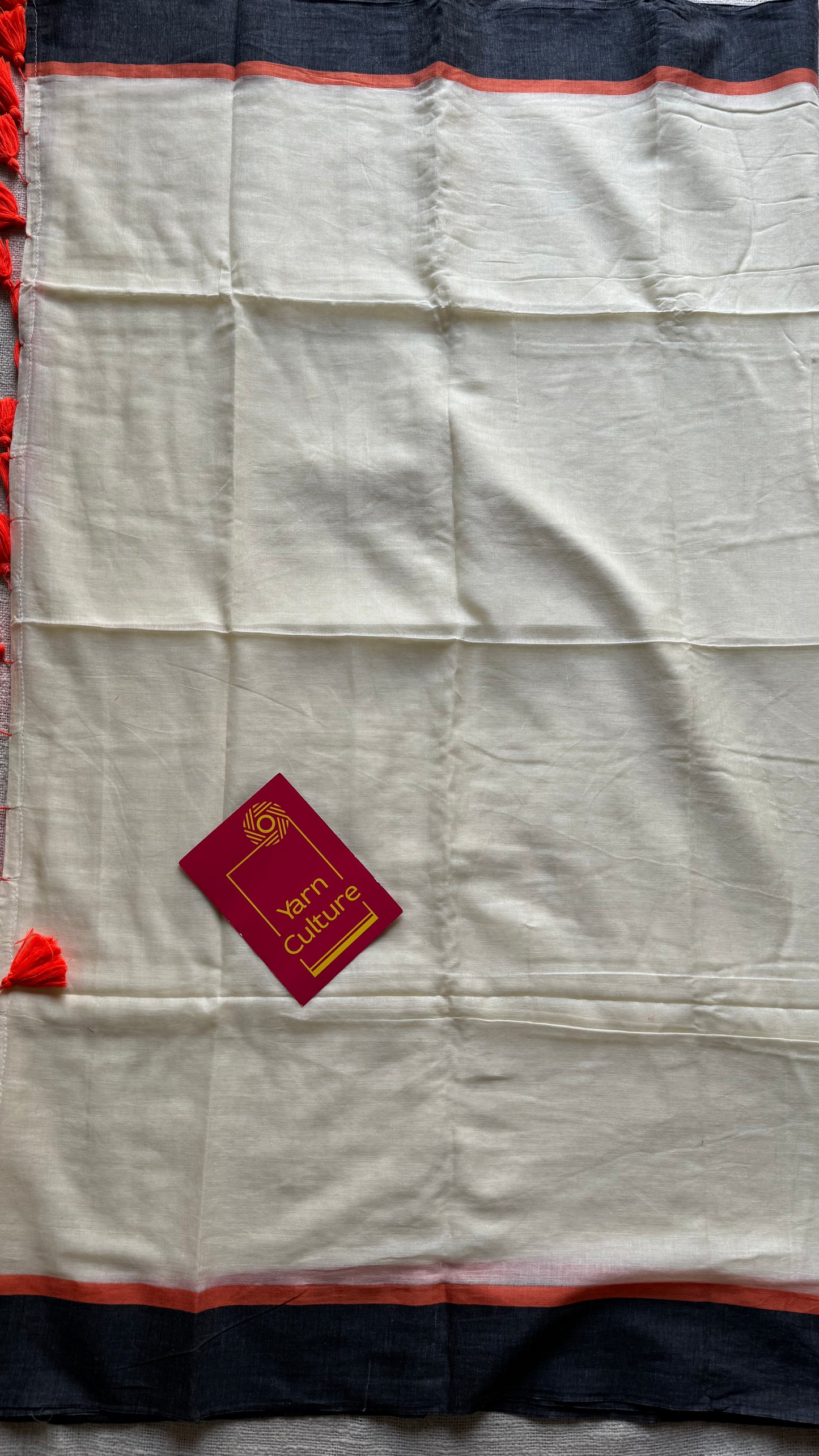 Ivory mul saree with black and orange border - YCBCMCFE293