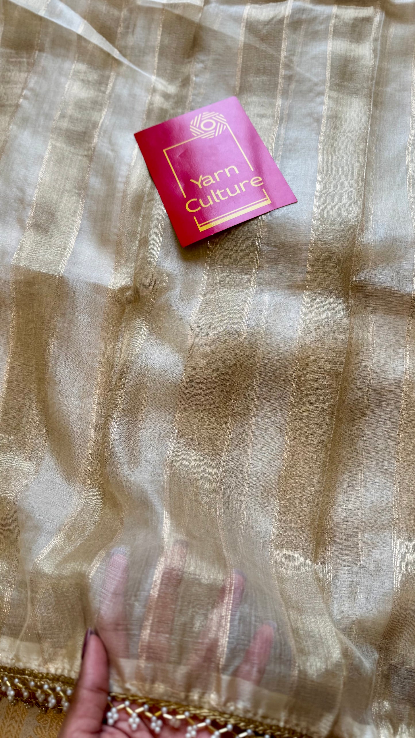 Gold soft semi tissue saree, striped body, pearl embellished border - YCIEON83