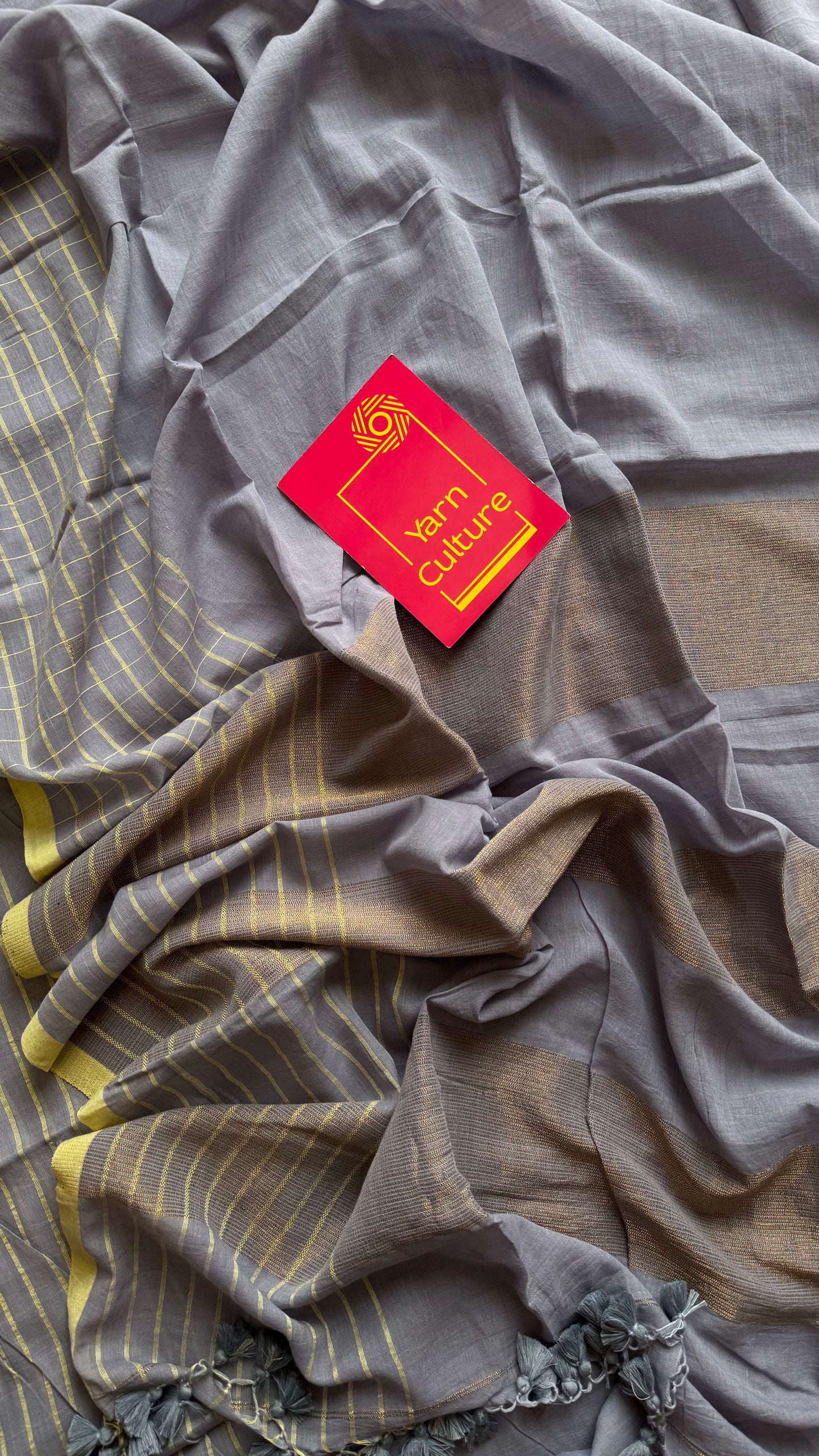 Grey handloom mul saree with custard yellow checkered borders and antique gold buttas - YCBCMCFE387