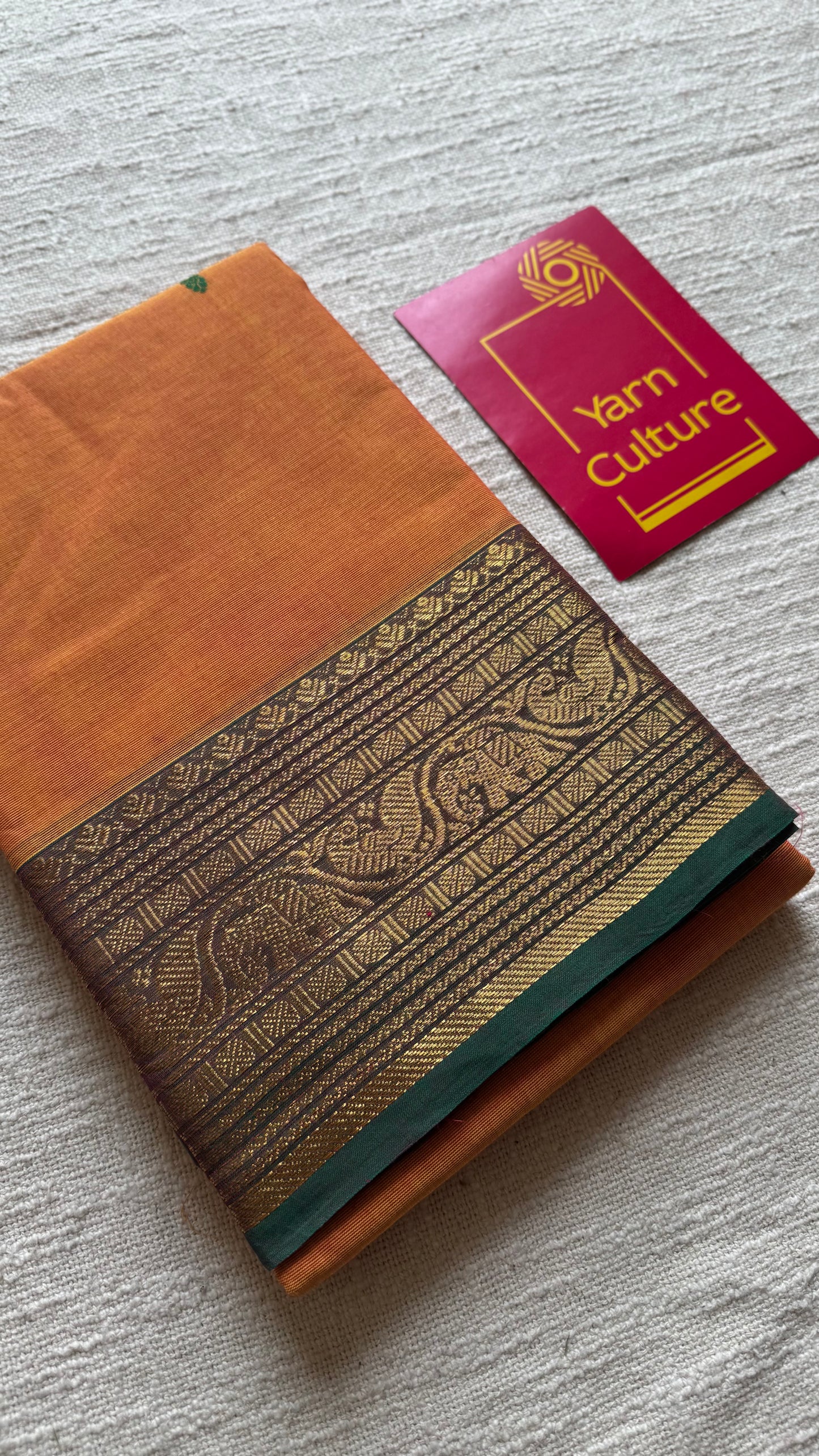 Kanchi cotton saree, light orange with green zari border - YCCOTNAP80