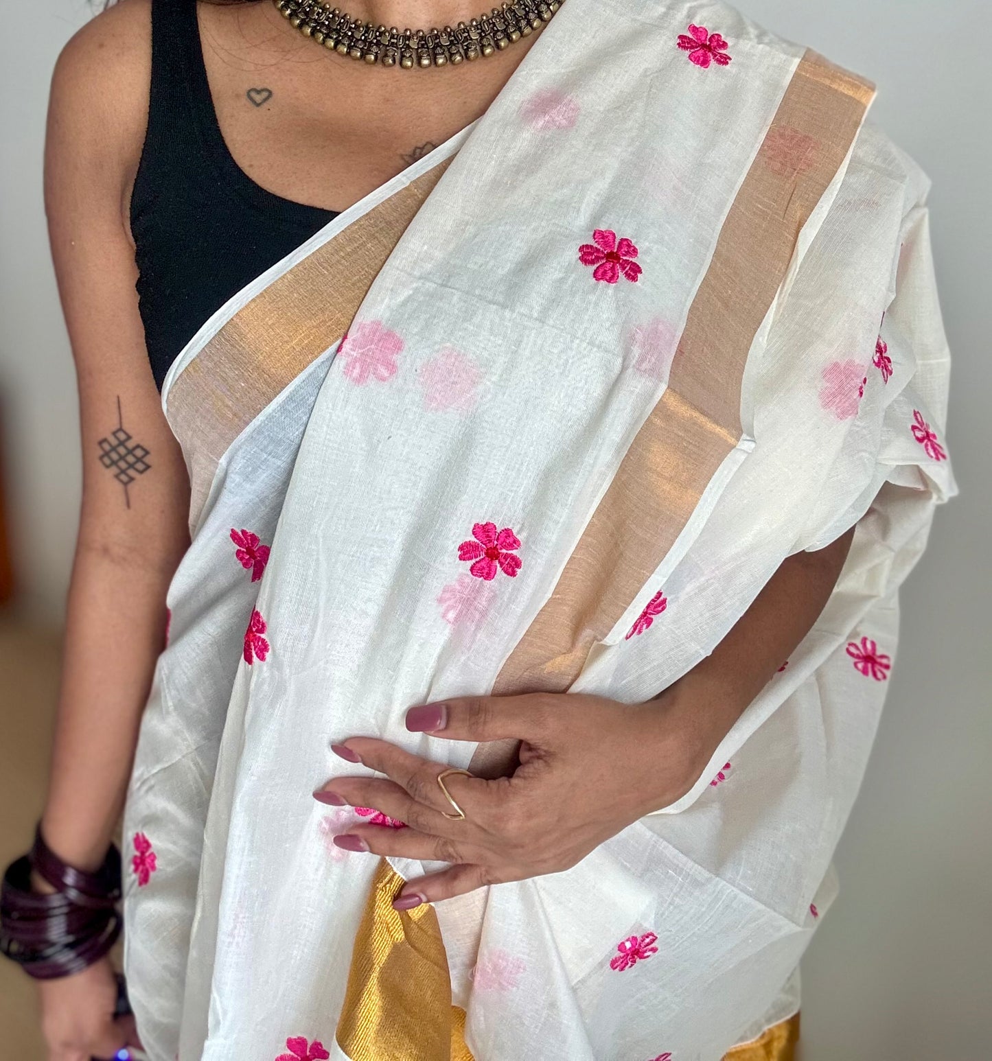 Ivory and antique gold soft cotton kasavu saree, pink parijat floral embroidery - YCIEON155