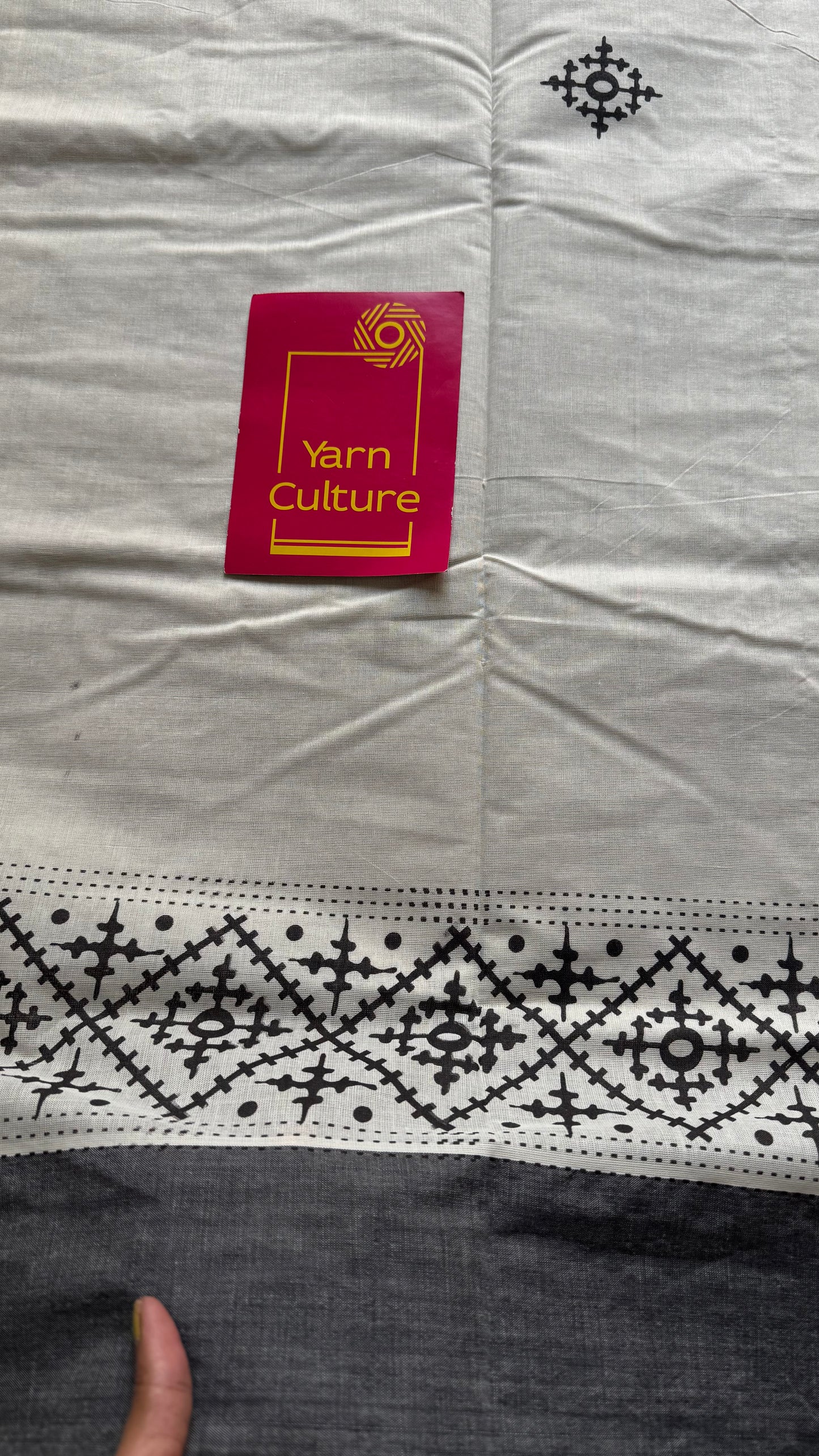 Ivory Kerala cotton saree with black Kutch-inspired printed borders and black centre pleats - YCIEKCFE312