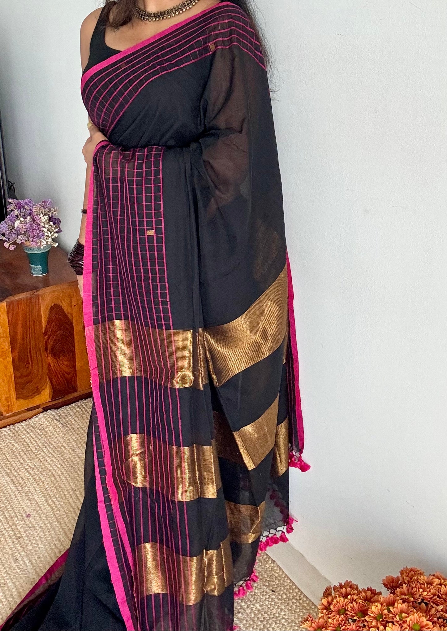 Black handloom mul saree with pink checkered borders and antique gold buttas - YCBCMCFE385