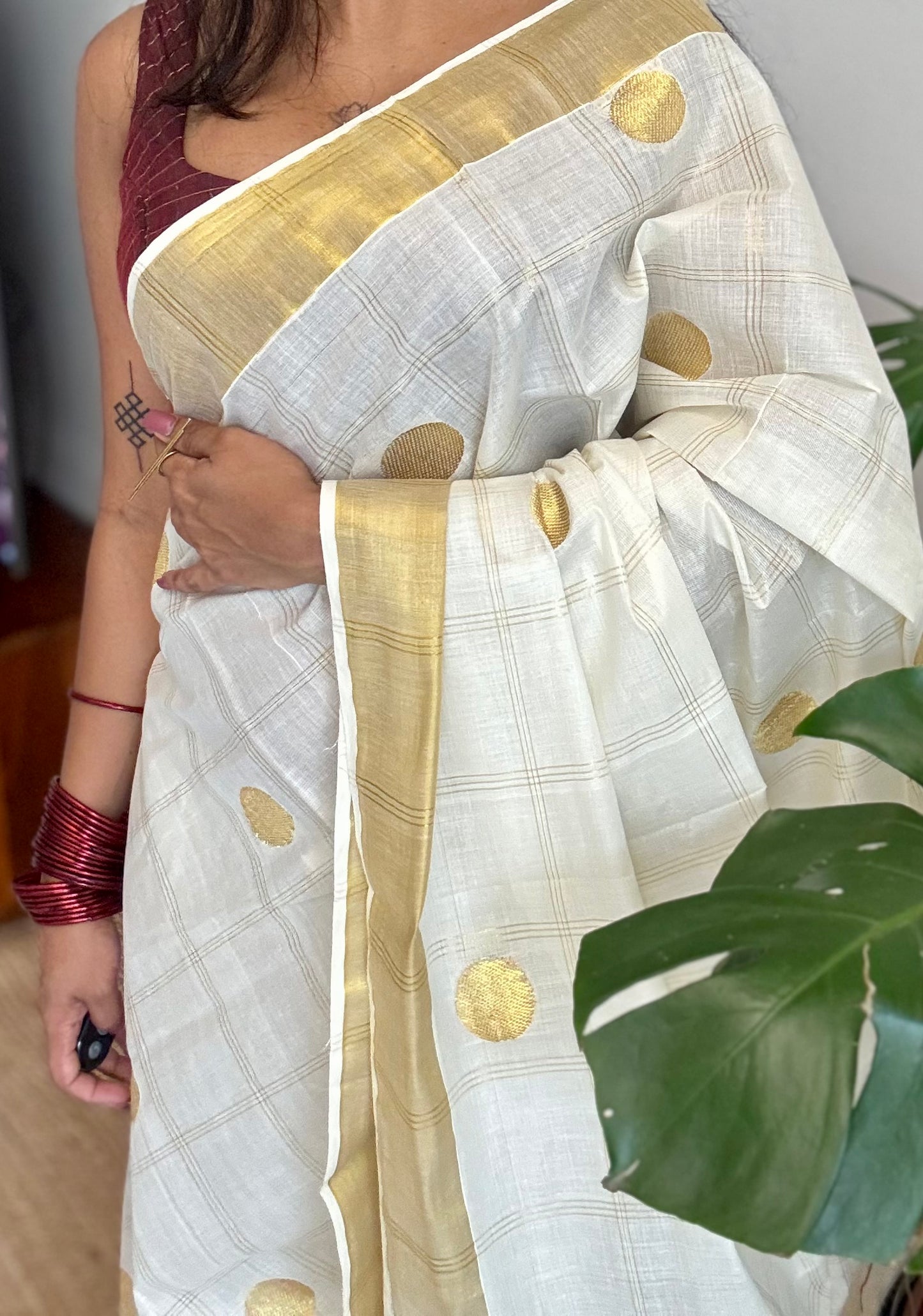 Ivory and gold kerala saree with gold buttas and checks - YCIEON41