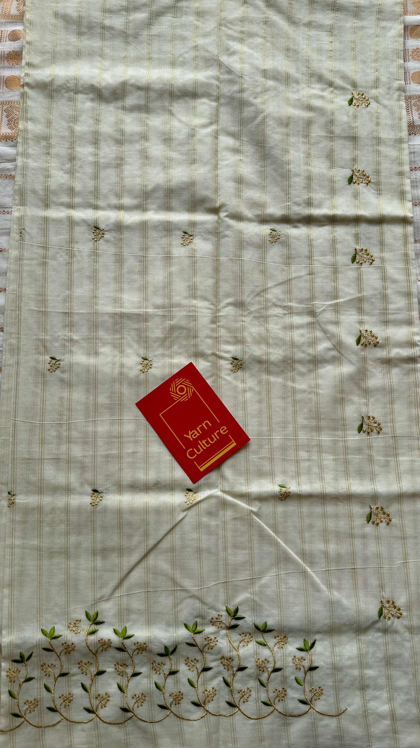 Ivory and gold soft cotton saree, light green floral vine embroidery - YCIEON59