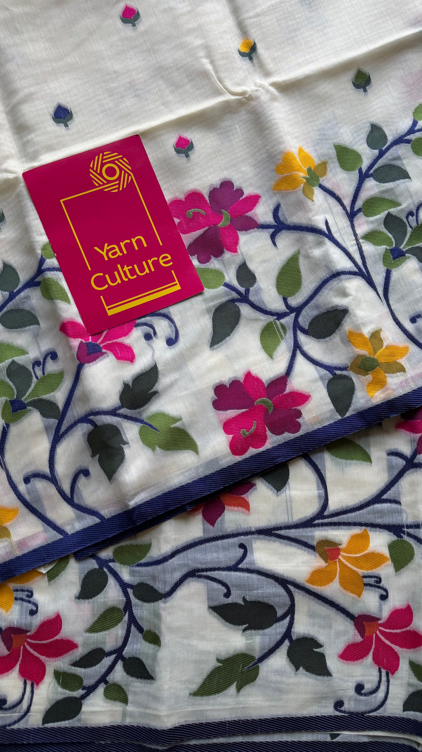 Ivory with navy blue border and multicolour floral motifs, cotton saree - YCIEBCFE325