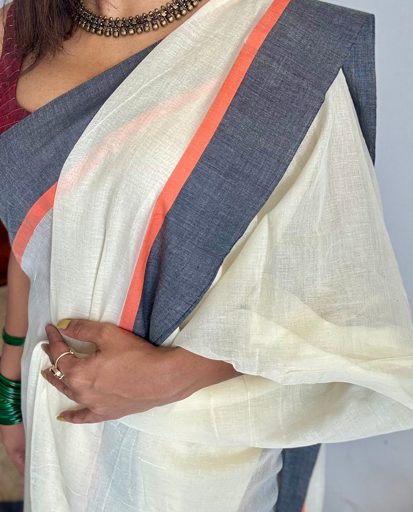 Ivory mul saree with black and orange border - YCBCMCFE293