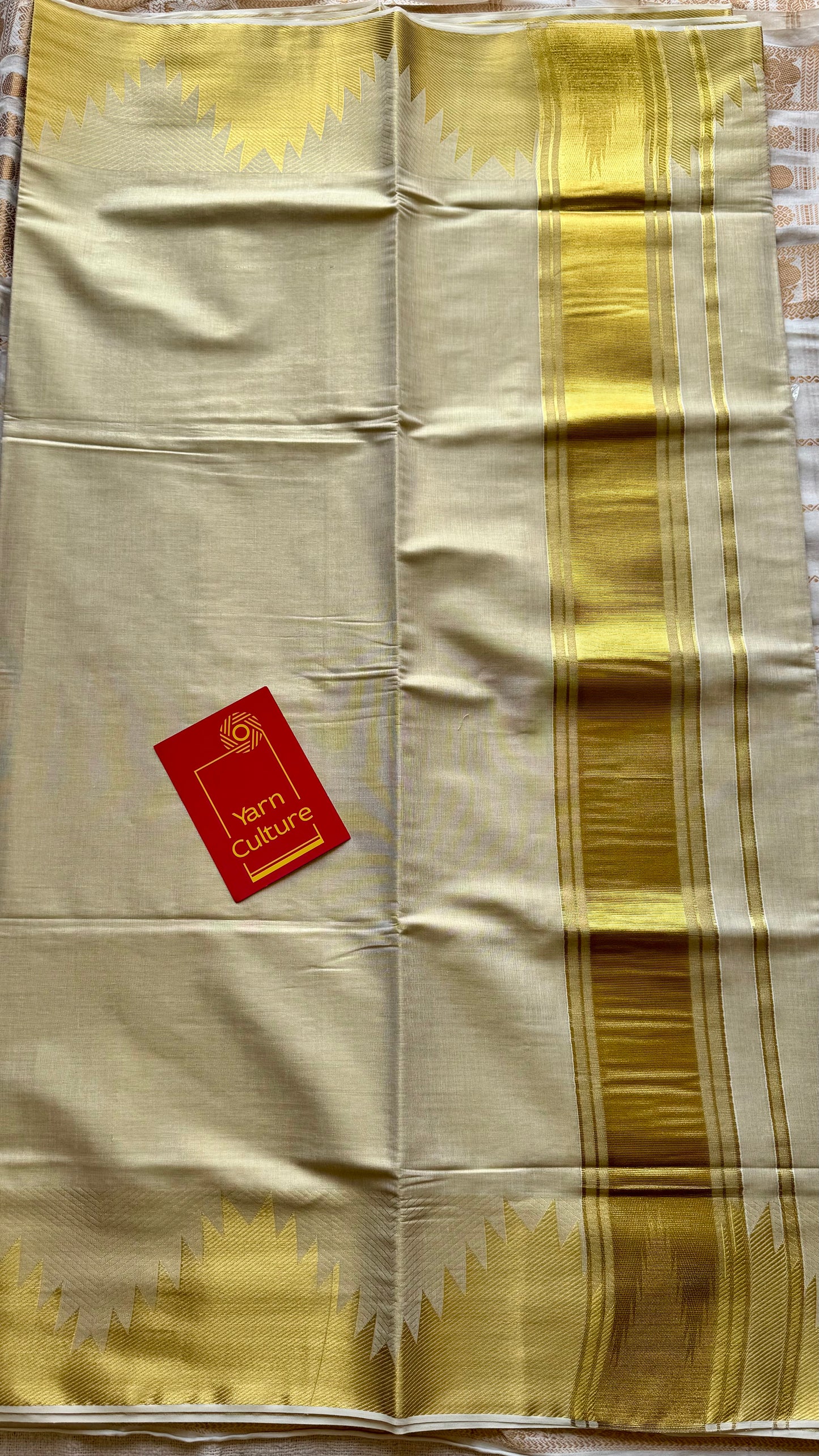 Ivory and gold soft tissue cotton saree, temple motif border - YCIEON81