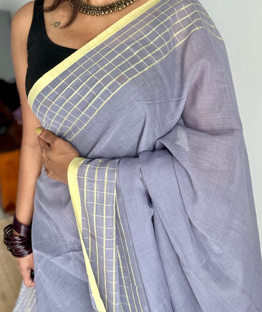 Grey handloom mul saree with custard yellow checkered borders and antique gold buttas - YCBCMCFE387