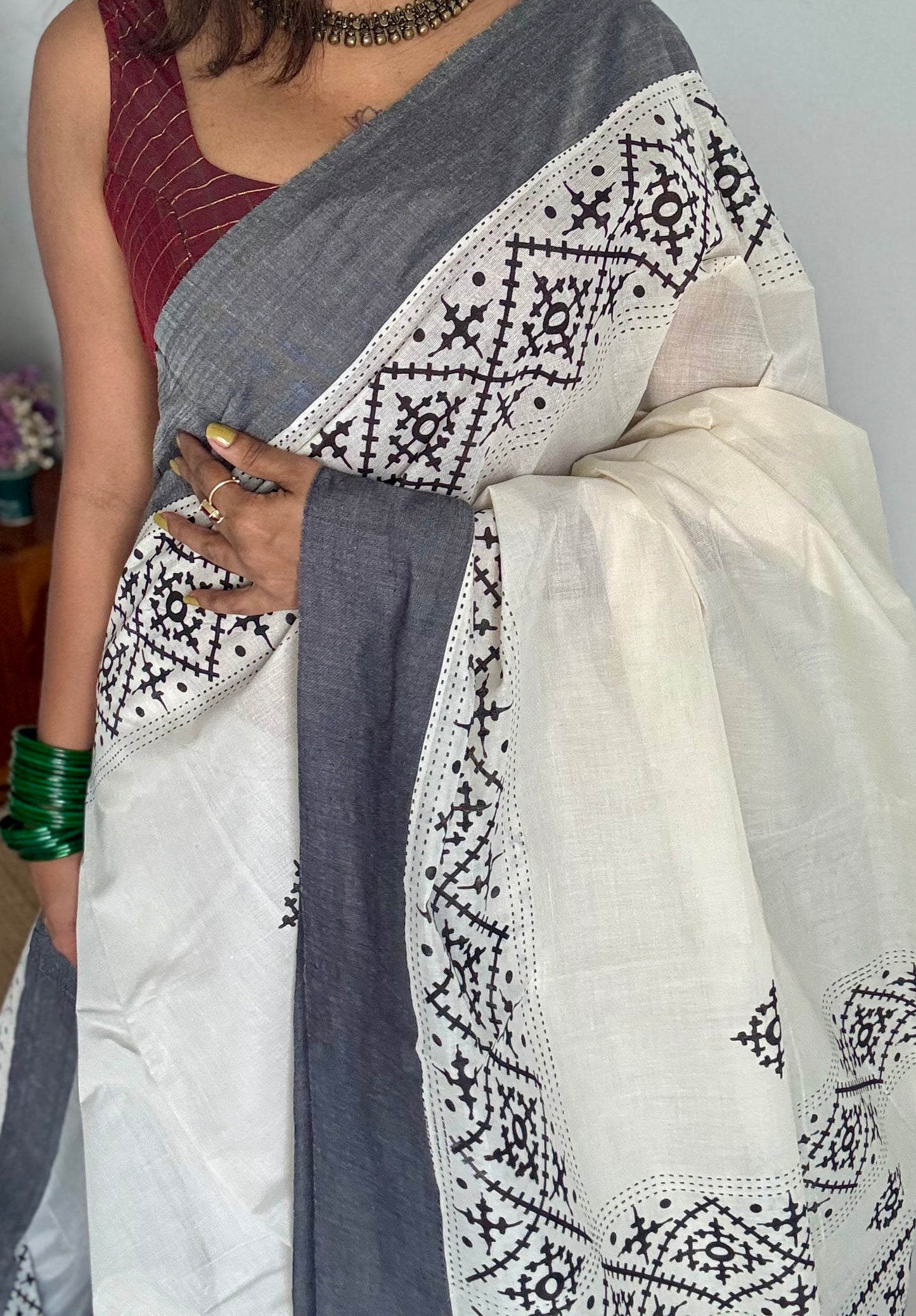 Ivory Kerala cotton saree with black Kutch-inspired printed borders and black centre pleats - YCIEKCFE312