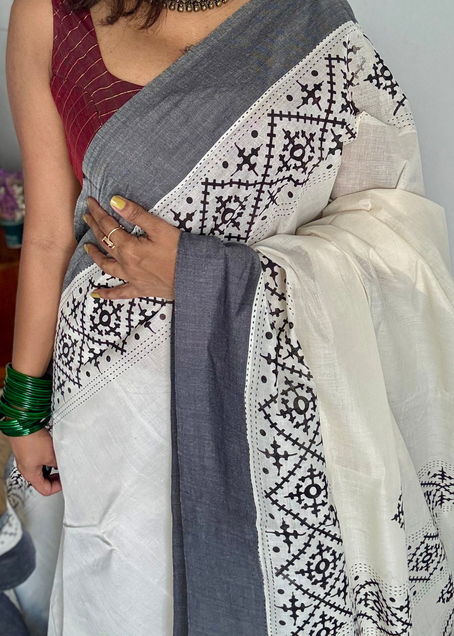 Ivory Kerala cotton saree with black Kutch-inspired printed borders and black centre pleats - YCIEKCFE312