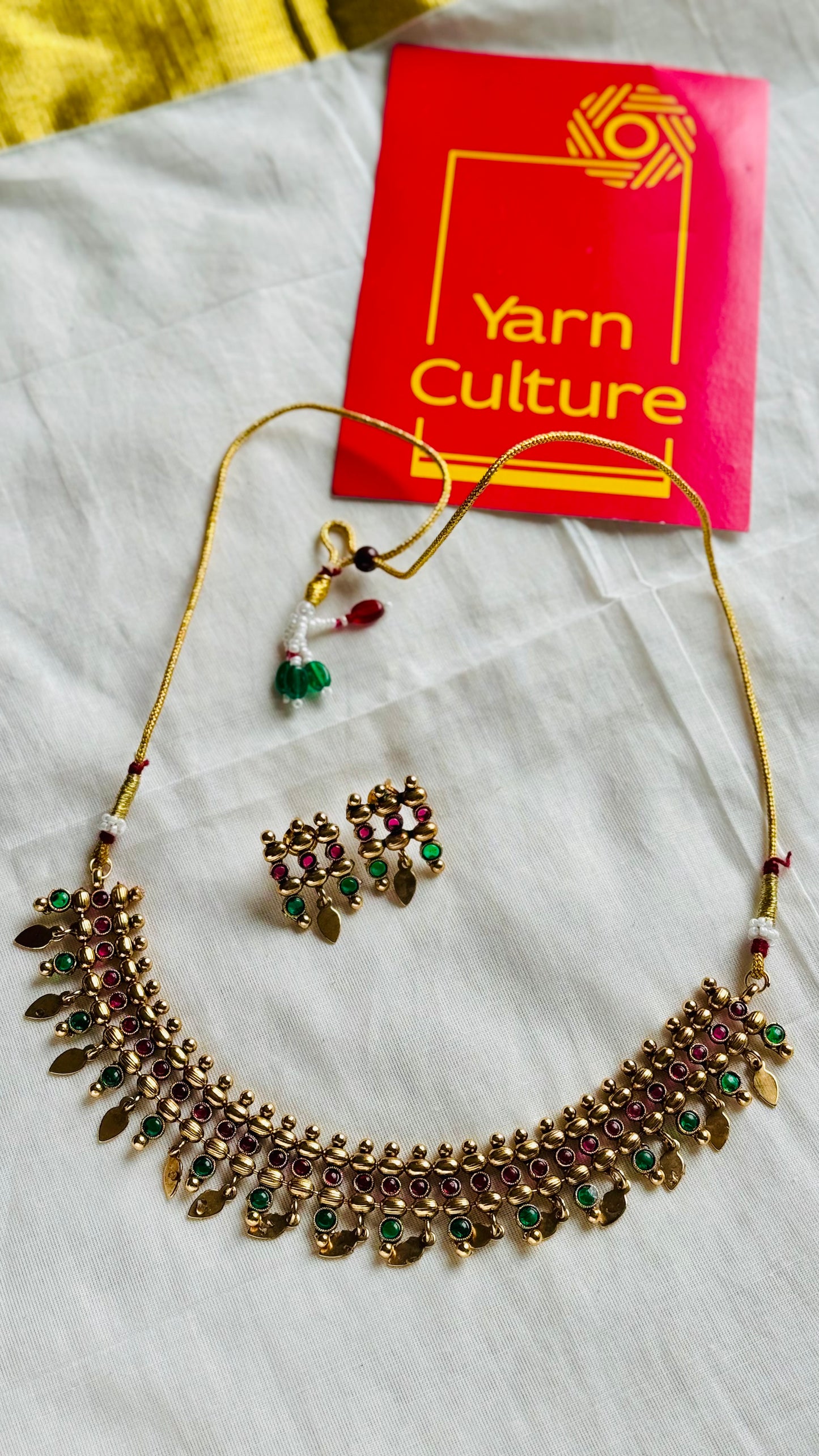 Elakkathali with ruby and green stones, with earrings - YCGPNP788