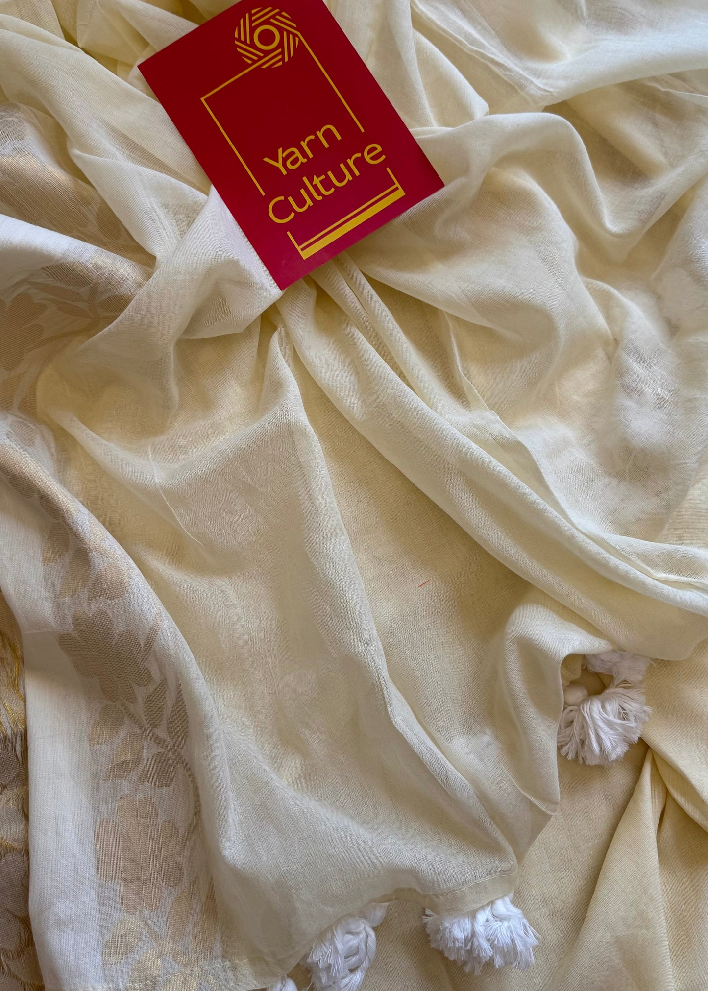 Ivory mul saree, zari flowers on border - YCIEON22