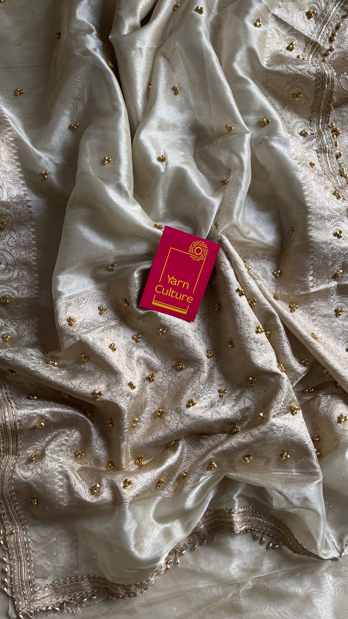 Ivory gold tissue Banarasi saree with ghungroo embellishments and beaded lace zari border - YCBLTOC70