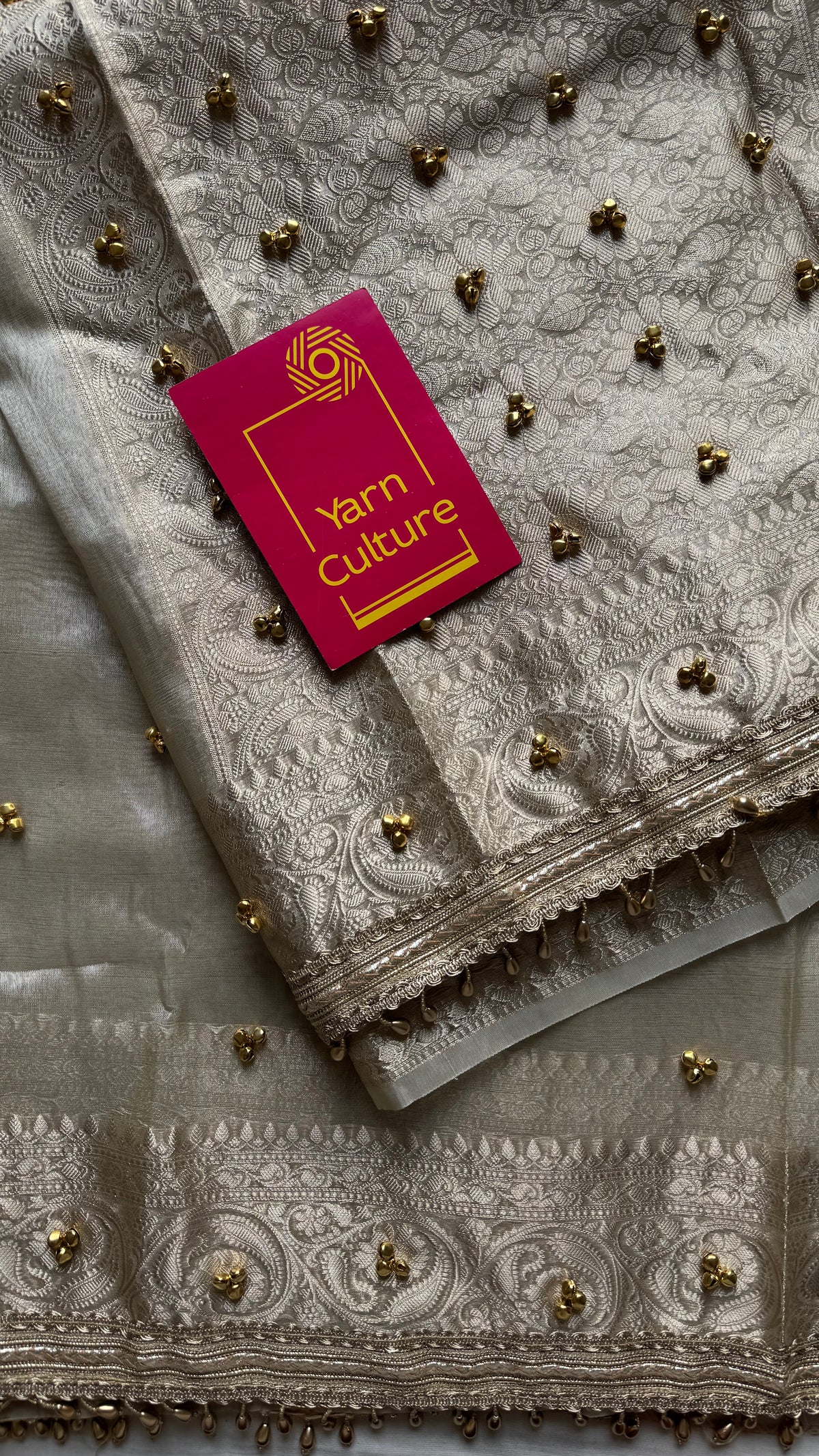 Ivory gold tissue Banarasi saree with ghungroo embellishments and beaded lace zari border - YCBLTOC70