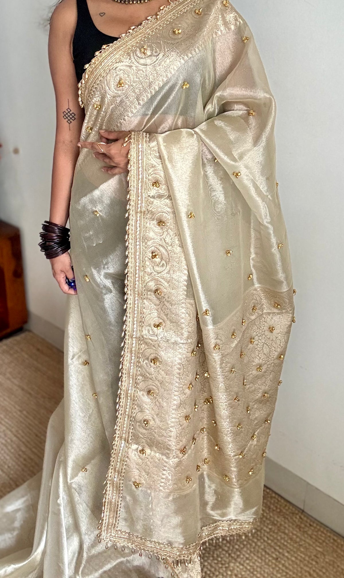 Ivory gold tissue Banarasi saree with ghungroo embellishments and beaded lace zari border - YCBLTOC70
