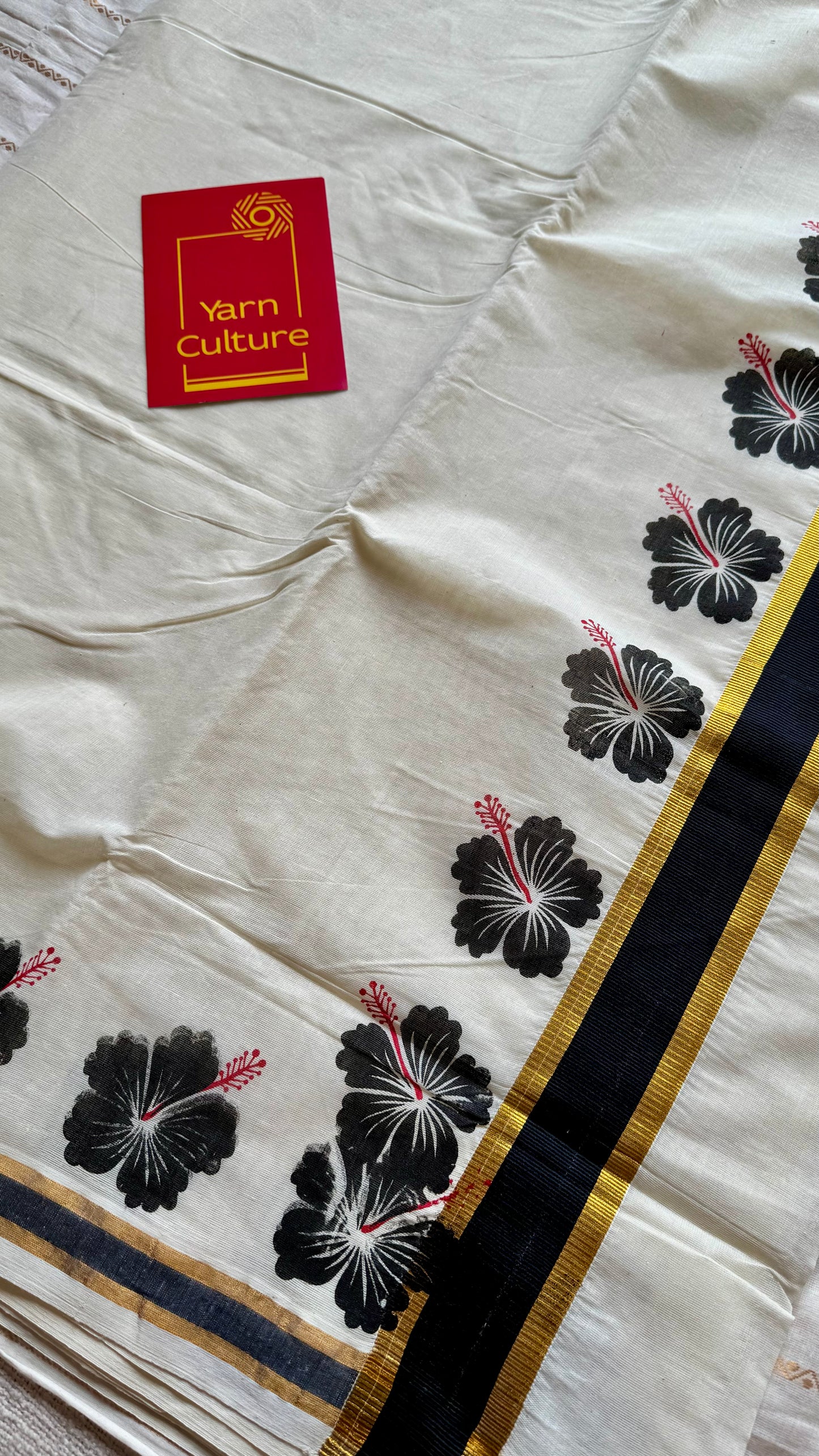 Ivory and gold soft cotton saree, black hibiscus (chembarathi) flowers - YCIEON61