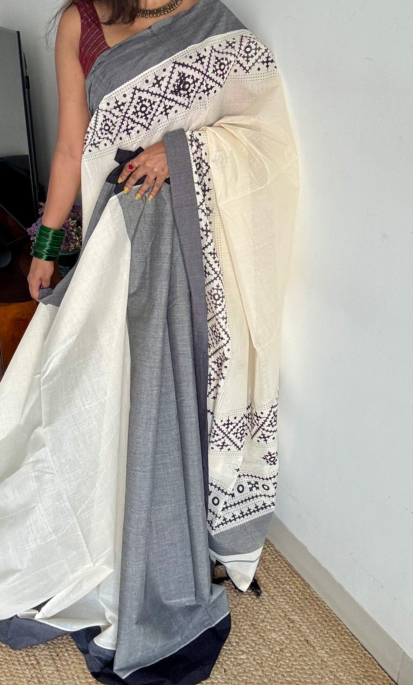 Ivory Kerala cotton saree with black Kutch-inspired printed borders and black centre pleats - YCIEKCFE312