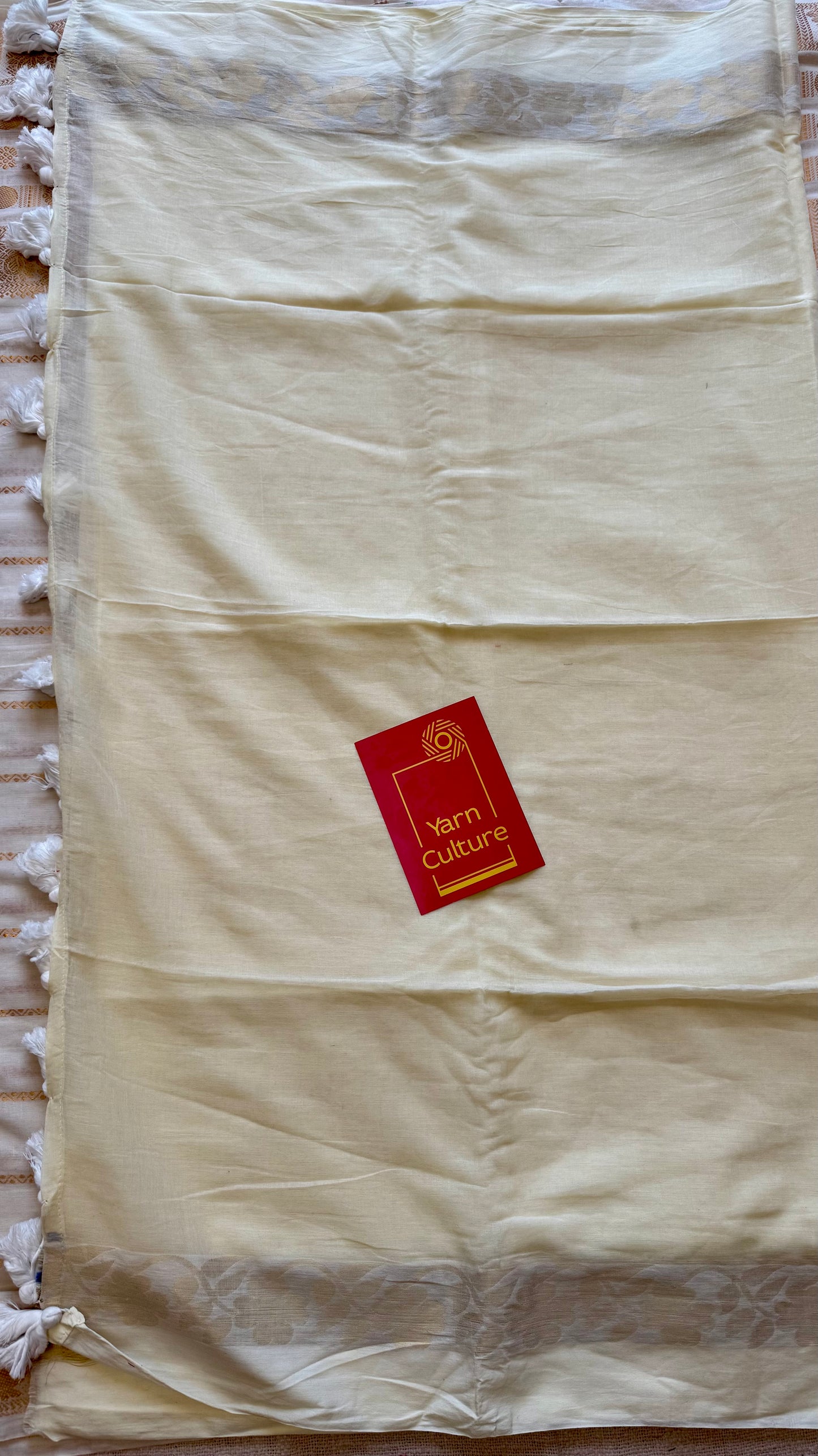 Ivory mul saree, zari flowers on border - YCIEON22