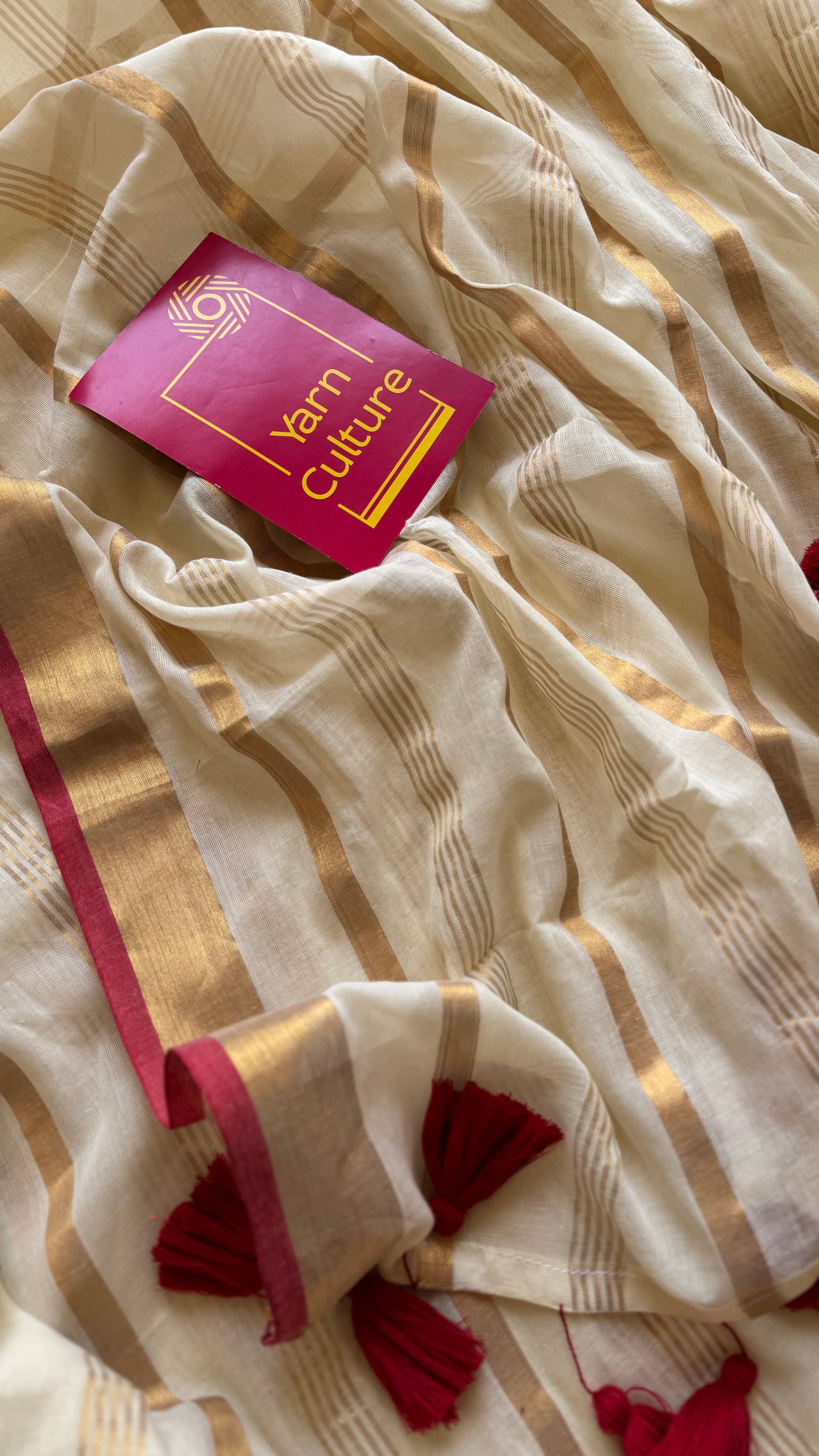 Ivory mul saree with gold stripes and red border - YCIEBCFE327