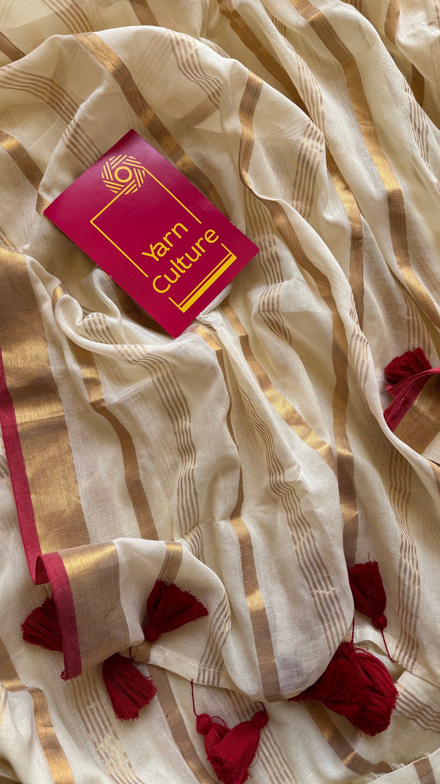 Ivory mul saree with gold stripes and red border - YCIEBCFE327