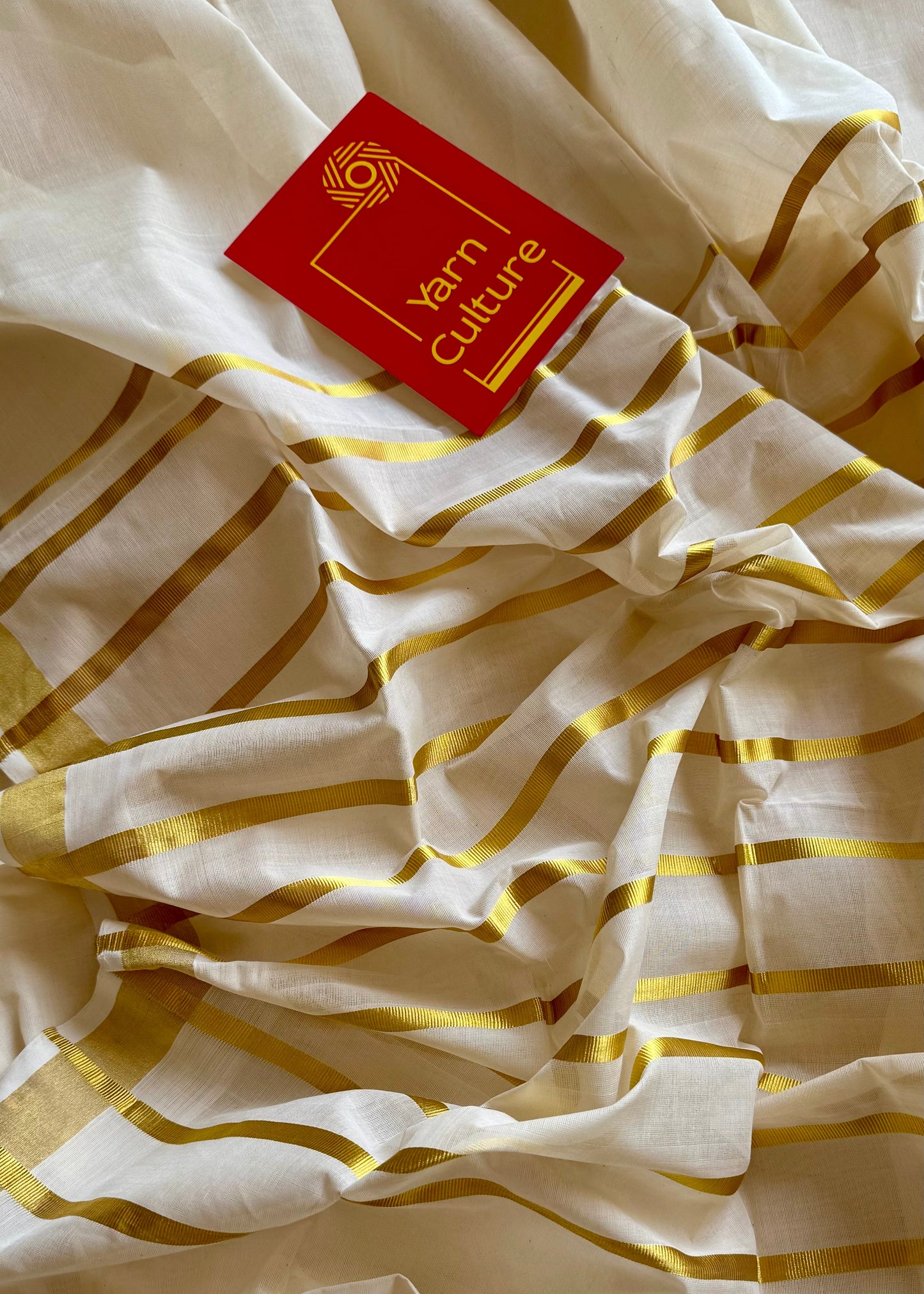Handloom, woven in Chendamangalam Looms, ivory with gold striped pallu - YCIEON147