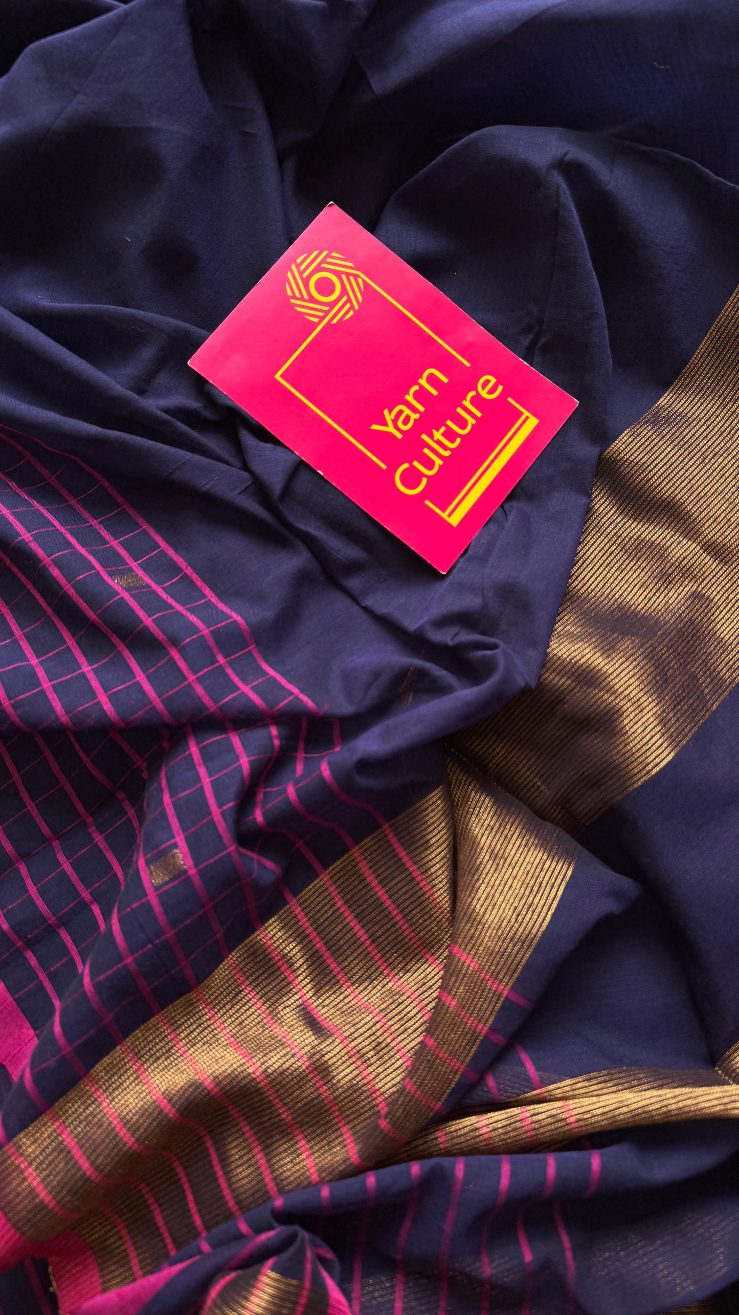 Navy handloom mul saree with hot pink checkered borders and antique gold buttas - YCBCMCFE386