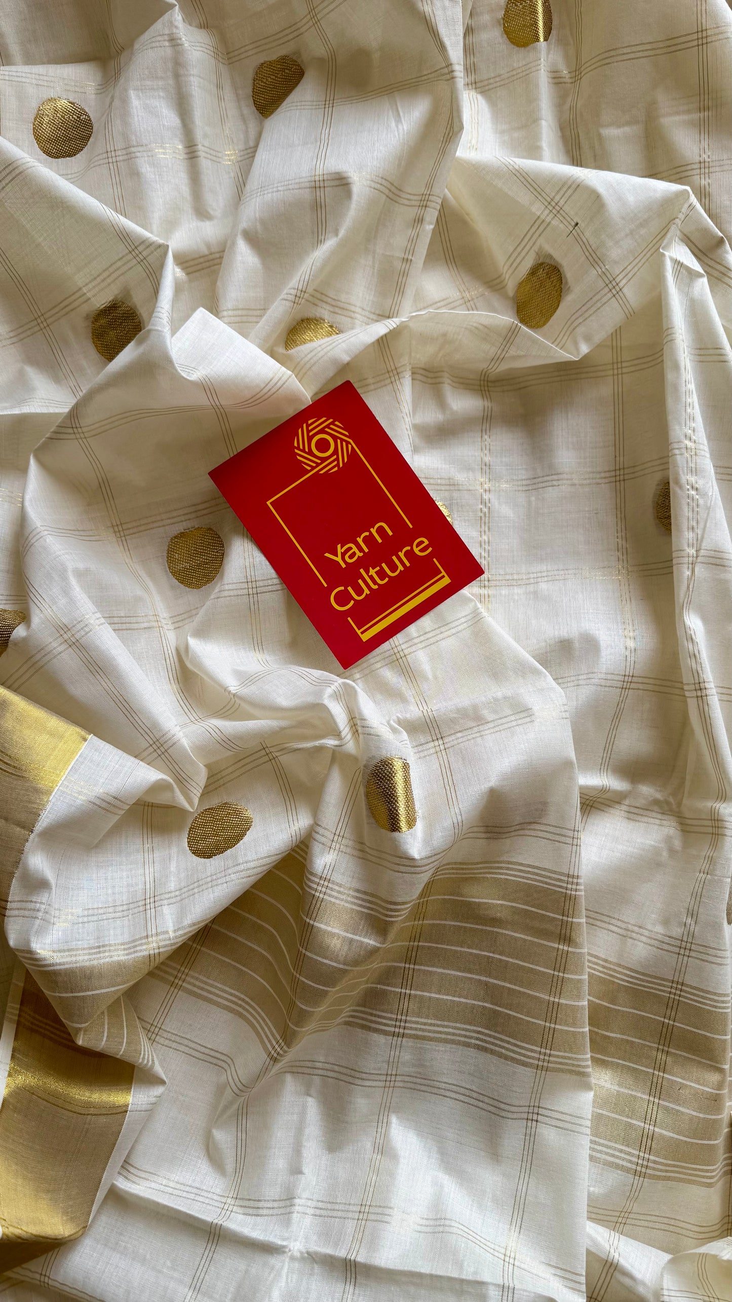 Ivory and gold kerala saree with gold buttas and checks - YCIEON41