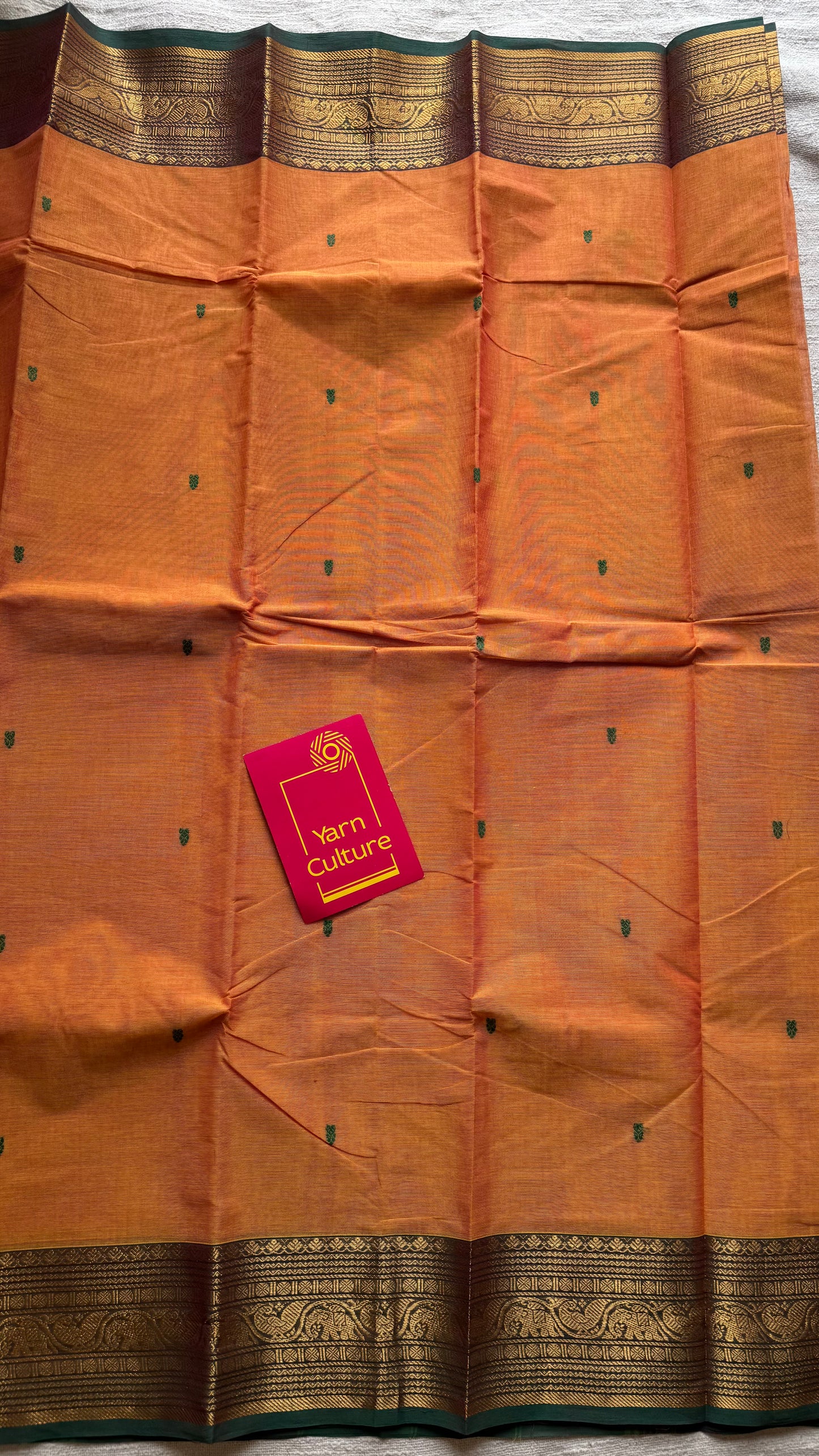 Kanchi cotton saree, light orange with green zari border - YCCOTNAP80