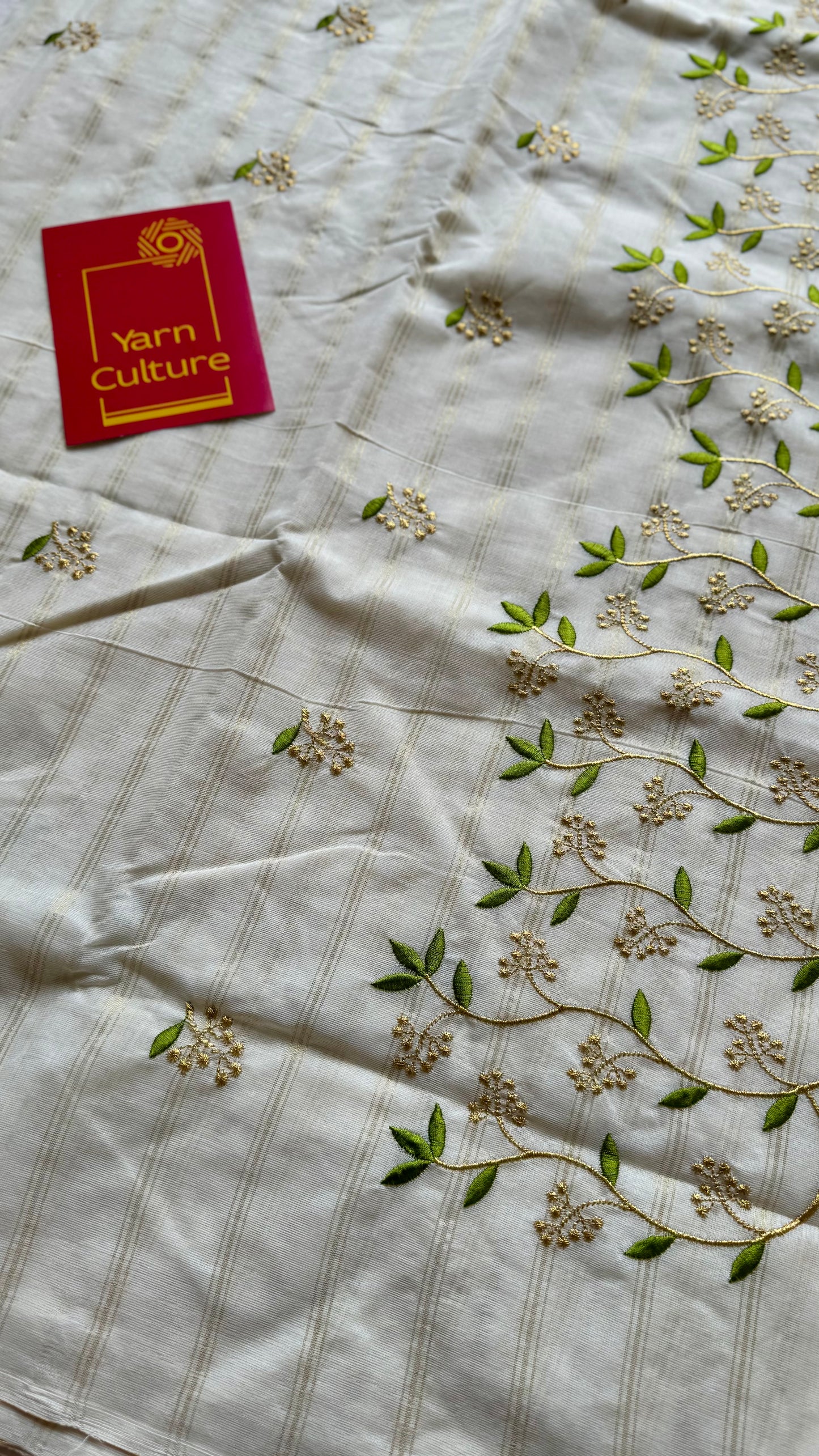 Ivory and gold soft cotton saree, light green floral vine embroidery - YCIEON59