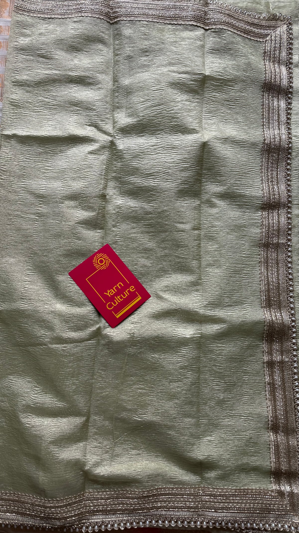 Pastel pista green crushed Banarasi tissue saree, with pearl lace border - YCBLTOC64
