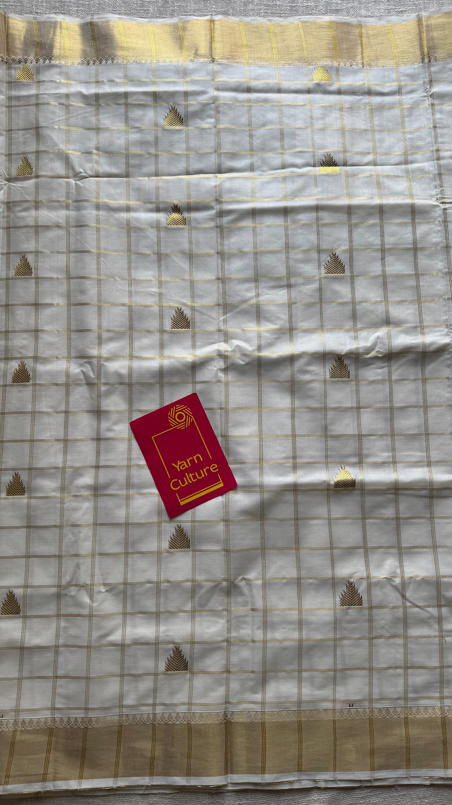 Ivory Kerala cotton saree with checks and gold jacquard motifs - YCIEKCFE319