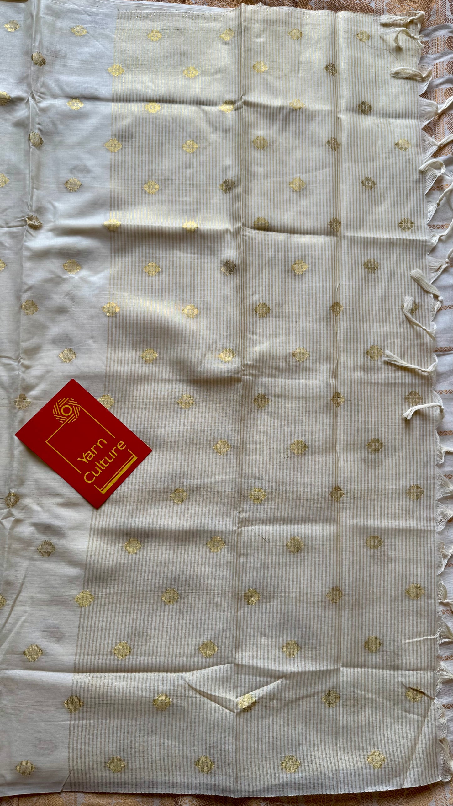 Ivory and gold kerala saree with woven buttas, striped pallu - YCIEON43