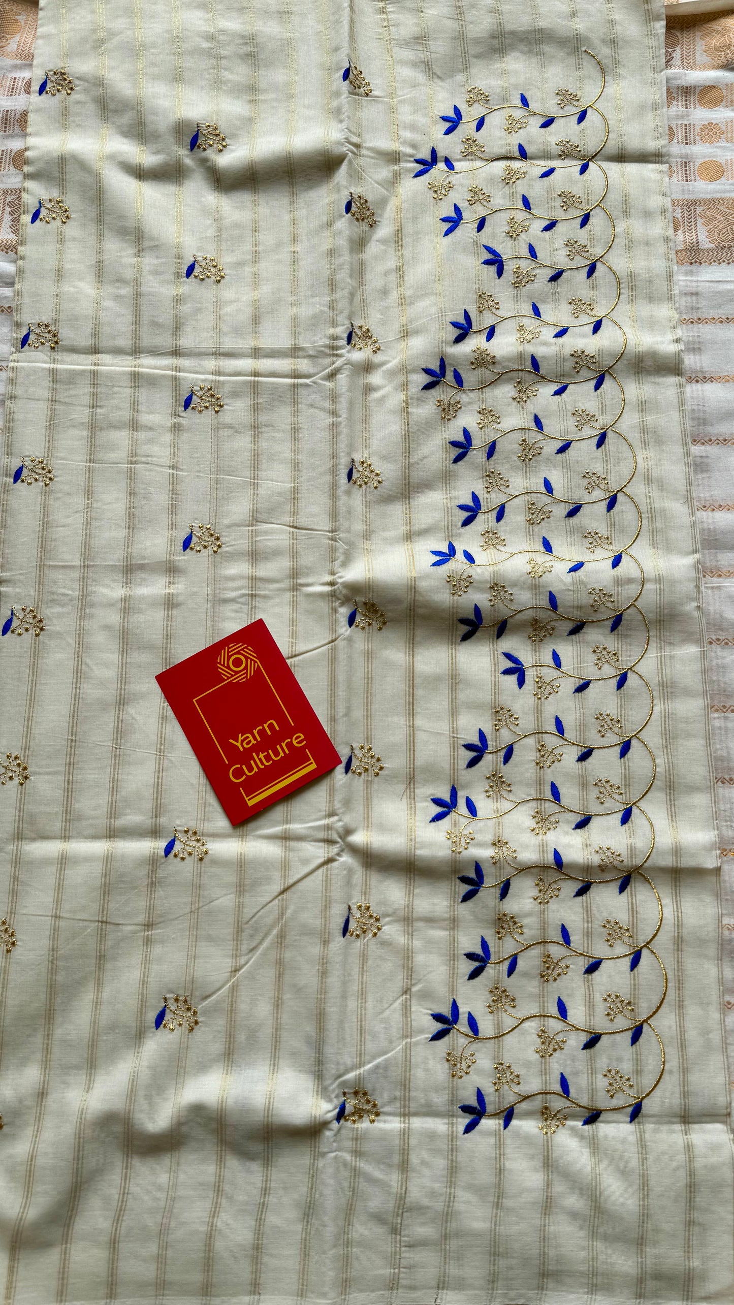 Ivory and gold soft cotton saree, blue floral vine embroidery  - YCIEON55