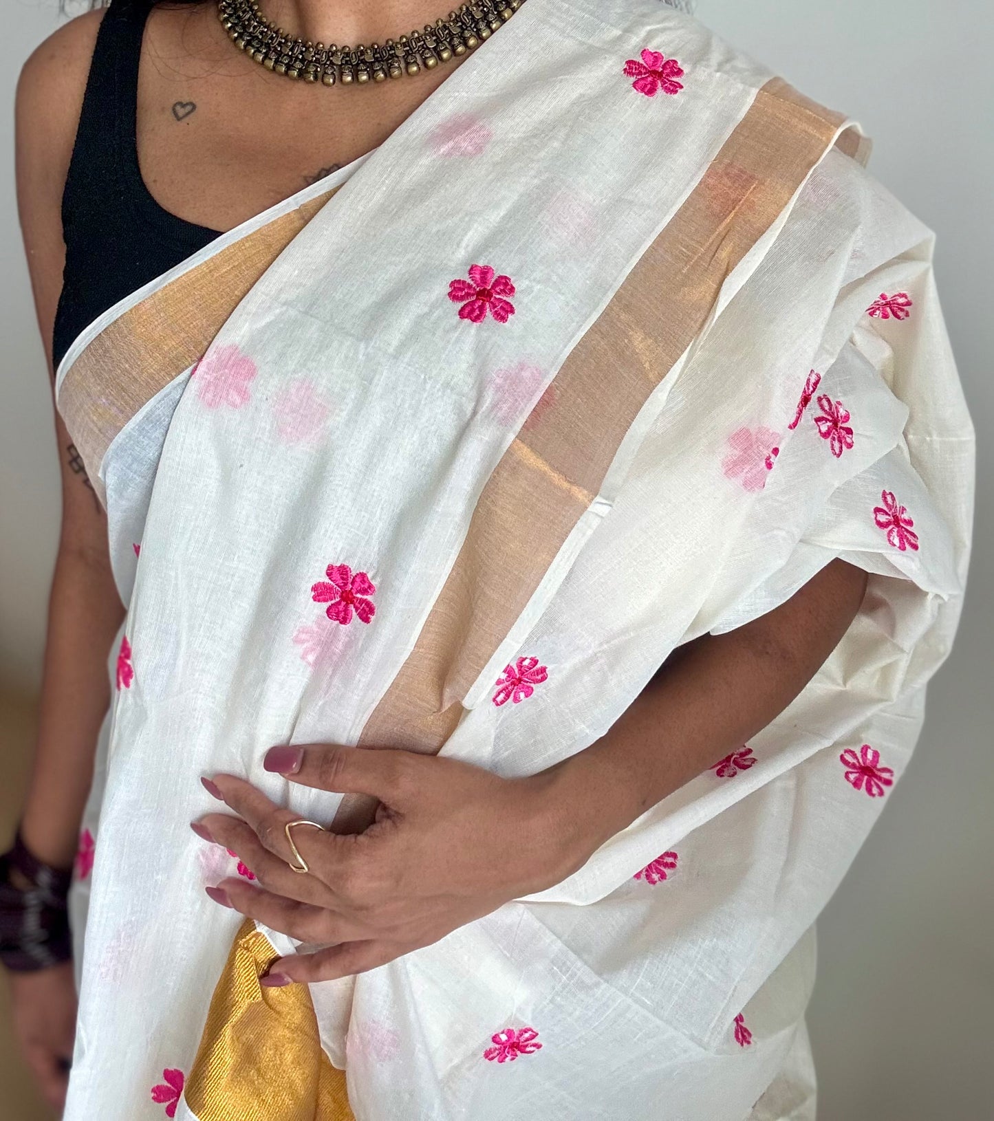 Ivory and antique gold soft cotton kasavu saree, pink parijat floral embroidery - YCIEON155