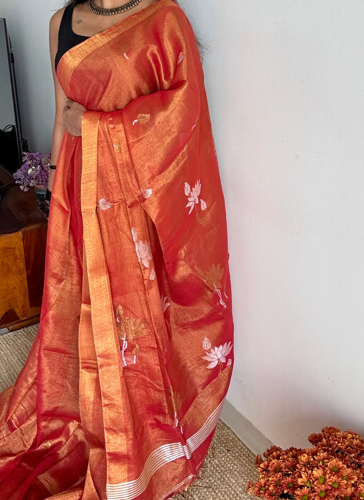 Handwoven orange gold dual tone tissue linen saree with lotus motifs - YCBCLTFE399