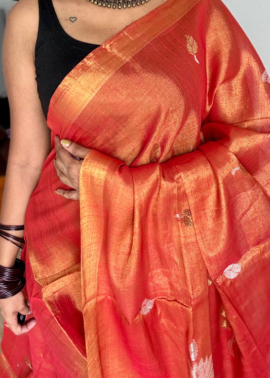 Handwoven orange gold dual tone tissue linen saree with lotus motifs - YCBCLTFE399