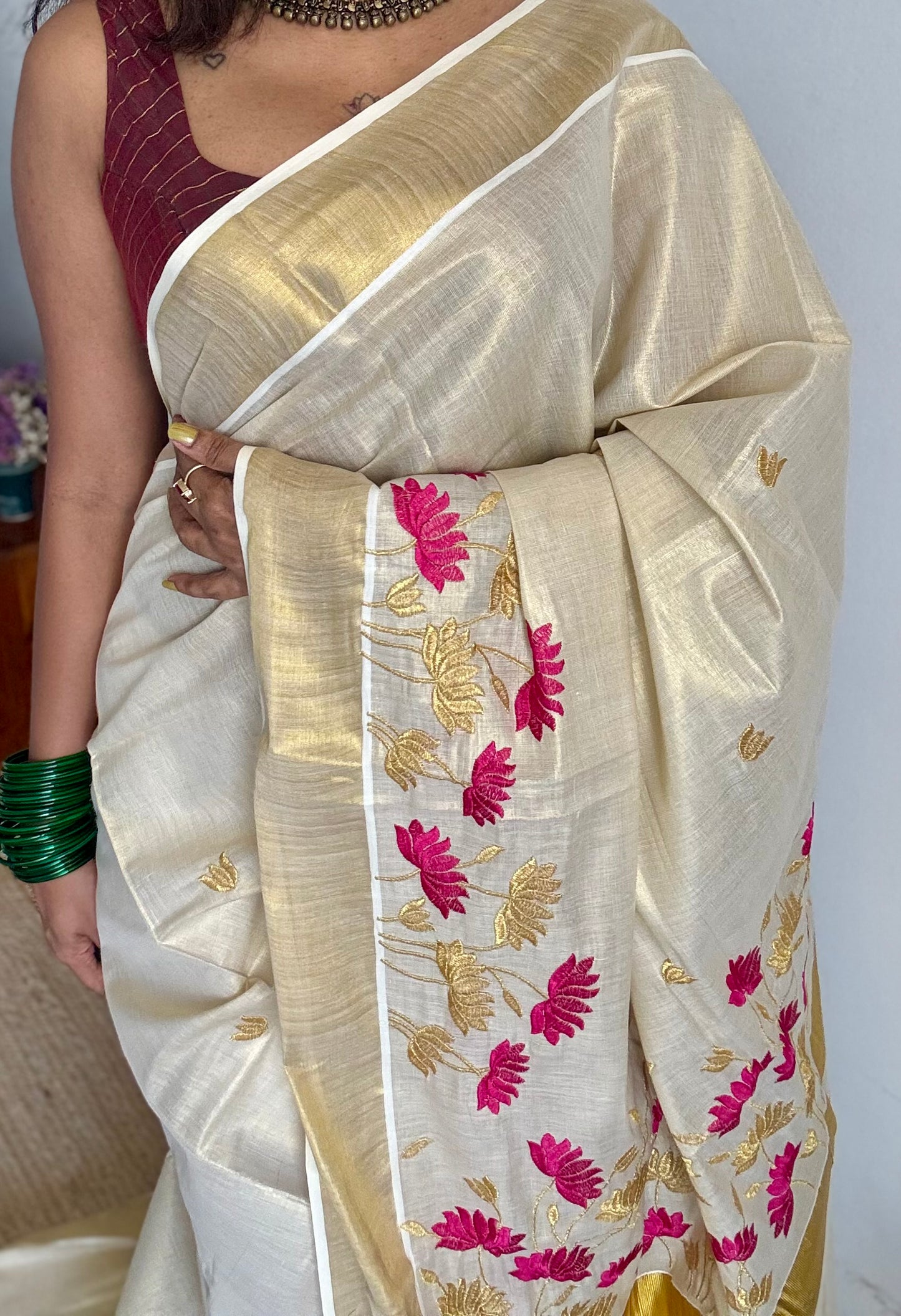 Ivory and gold tissue kerala cotton saree with hot pink and gold lotus embroidery - YCIEKCFE315