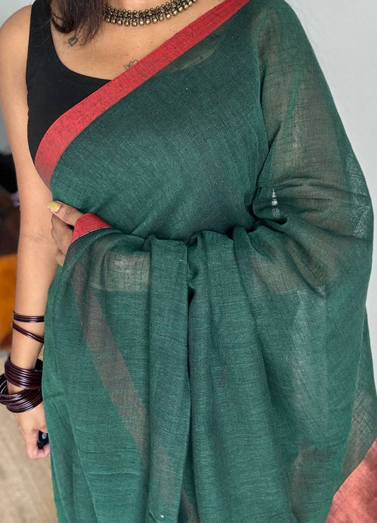 Dark green plain linen by cotton saree with copper zari pallu - YCBCLCFE397