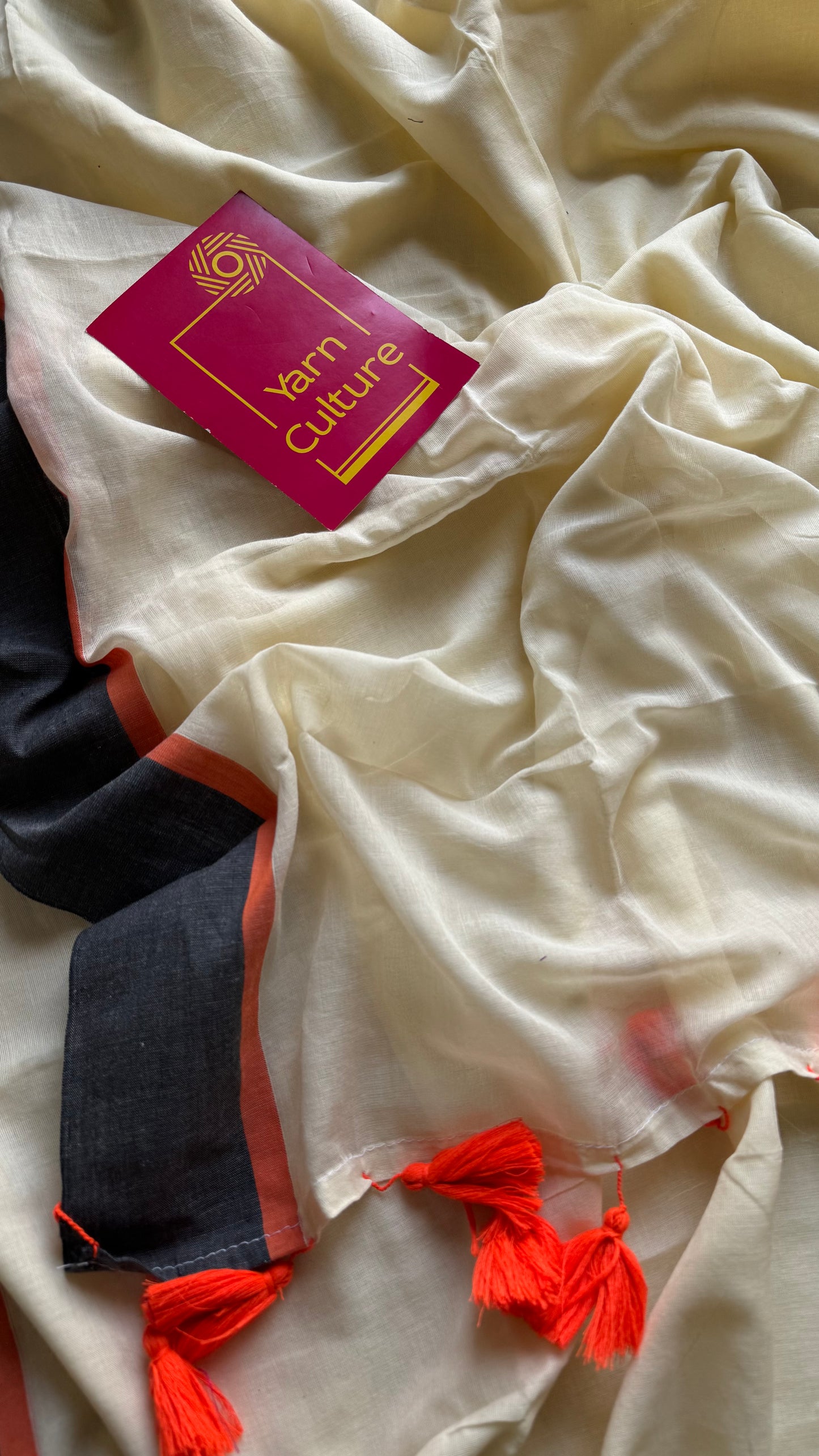 Ivory mul saree with black and orange border - YCBCMCFE293