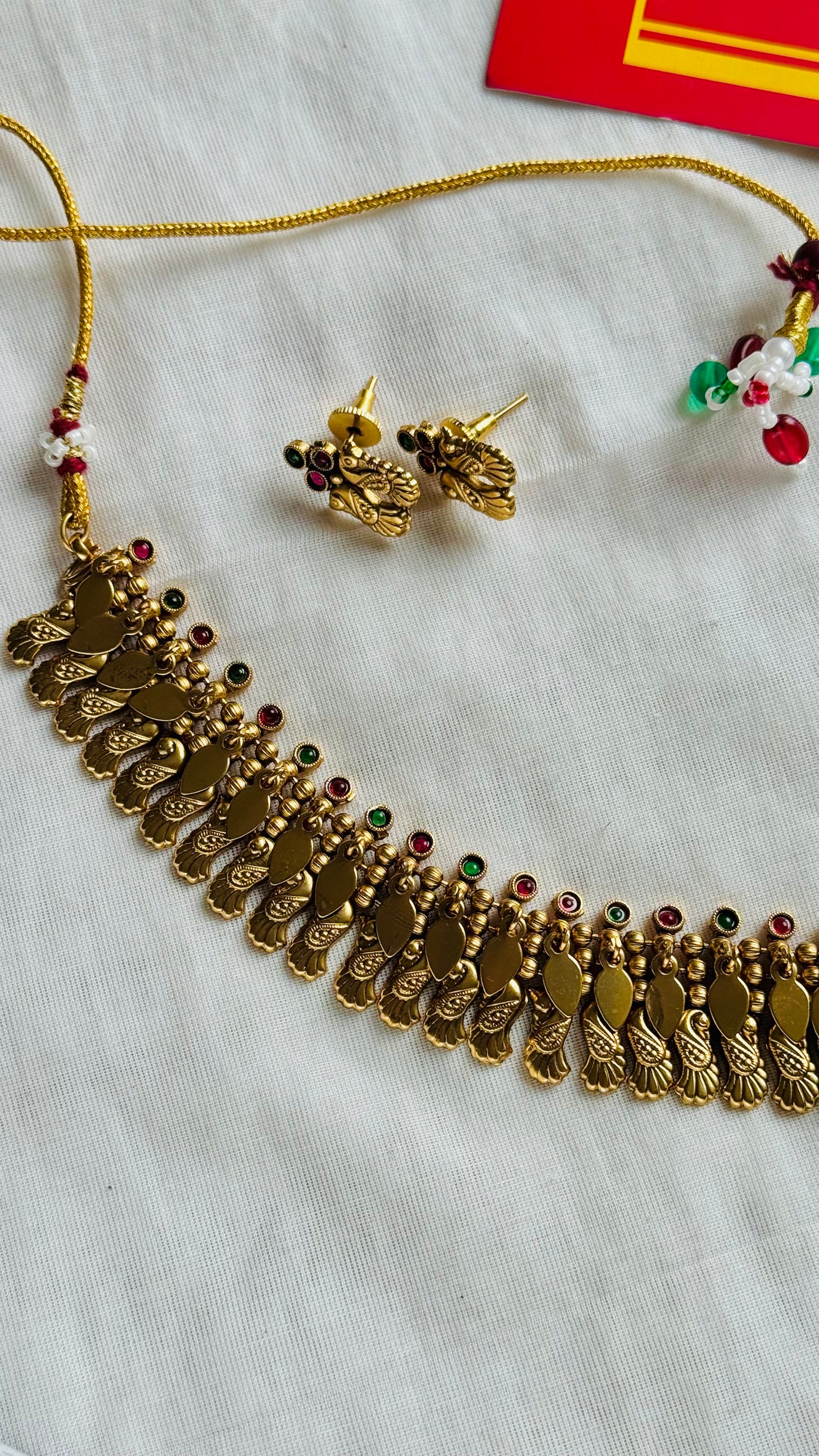 Elakkathali with peacock shaped pendant, ruby and green stones, with earrings - YCGPNP794