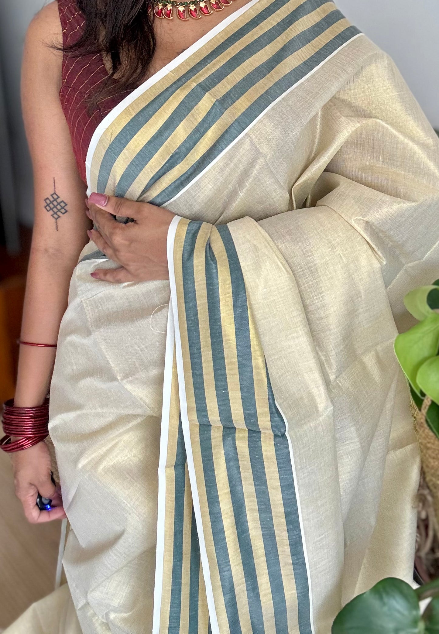 Ivory and gold soft tissue cotton saree, dark green border - YCIEON68