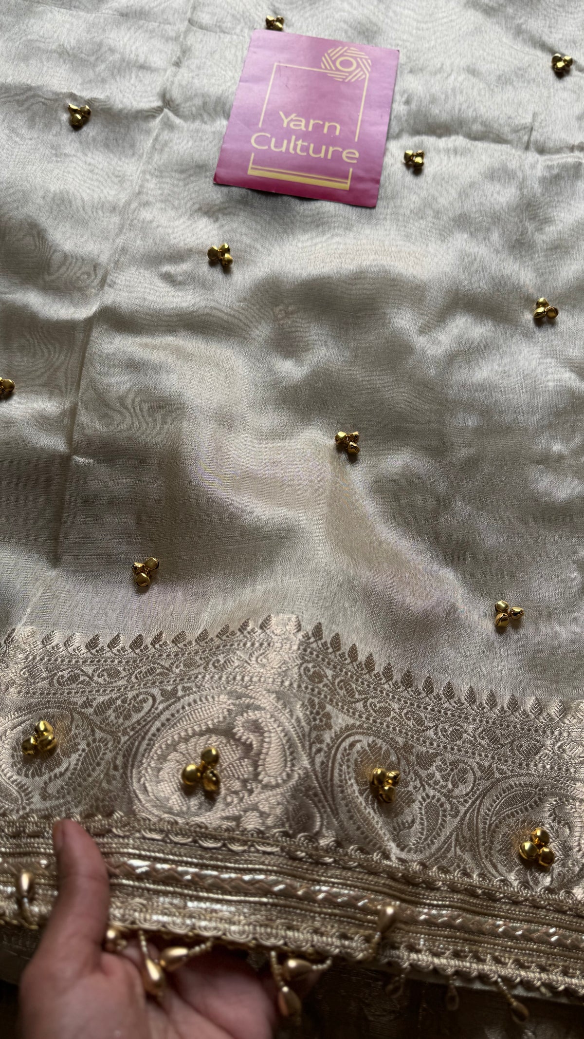 Ivory gold tissue Banarasi saree with ghungroo embellishments and beaded lace zari border - YCBLTOC70