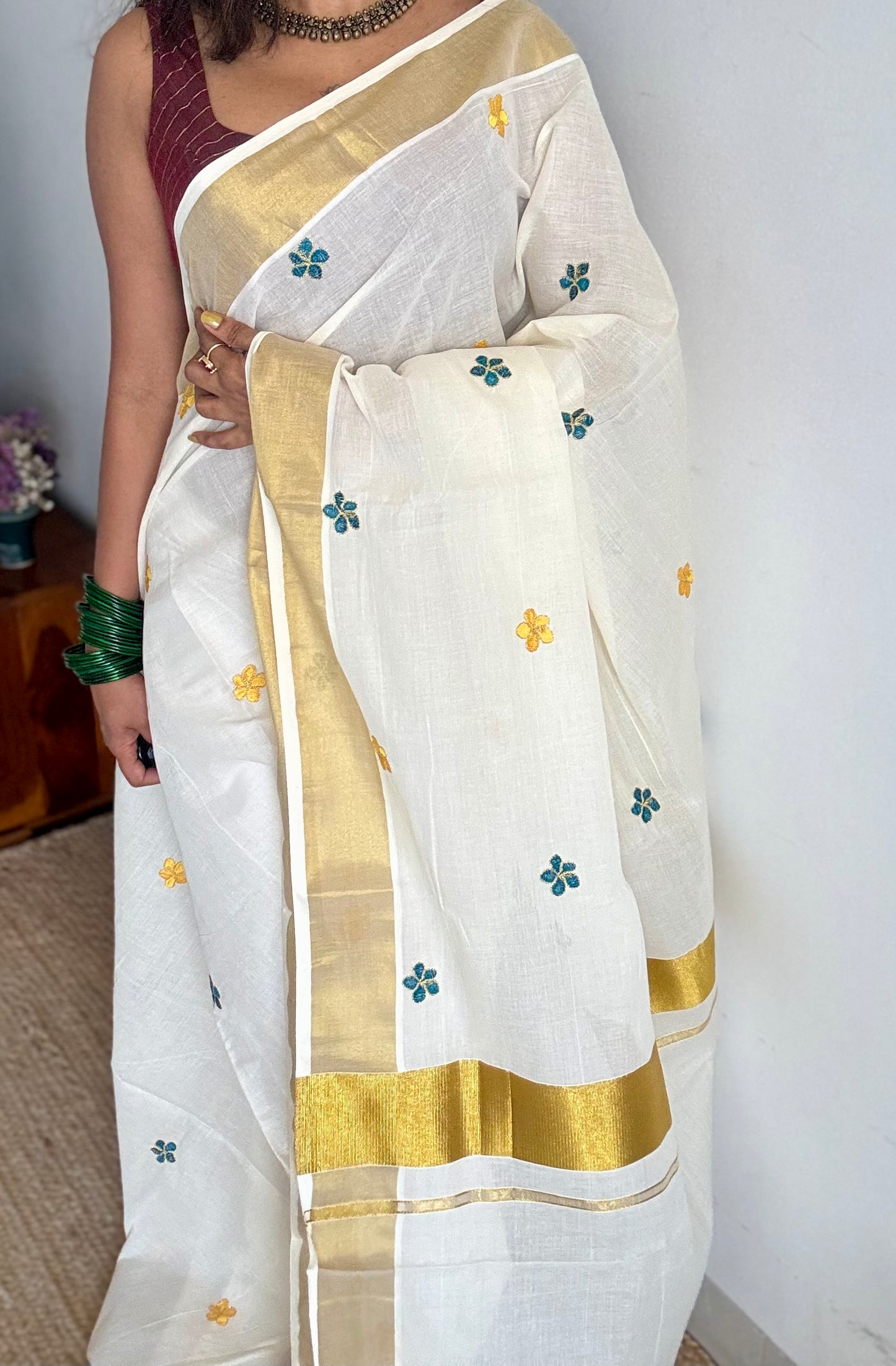 Ivory and gold saree with peacock blue and yellow floral embroidery - YCIEKCFE309