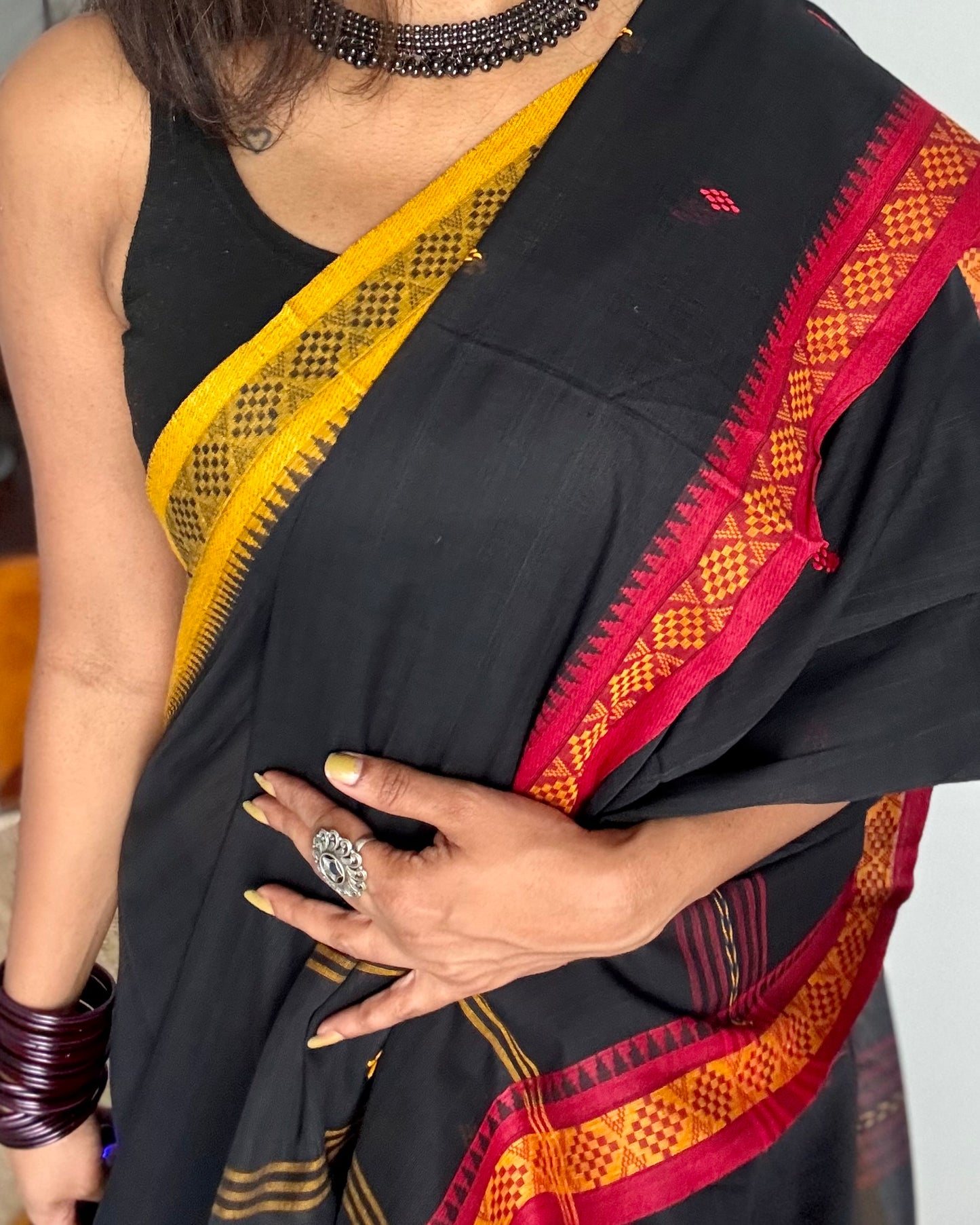 Dhonekhali handloom soft cotton saree, black with red and yellow woven buttas and border - YCBCDFE259