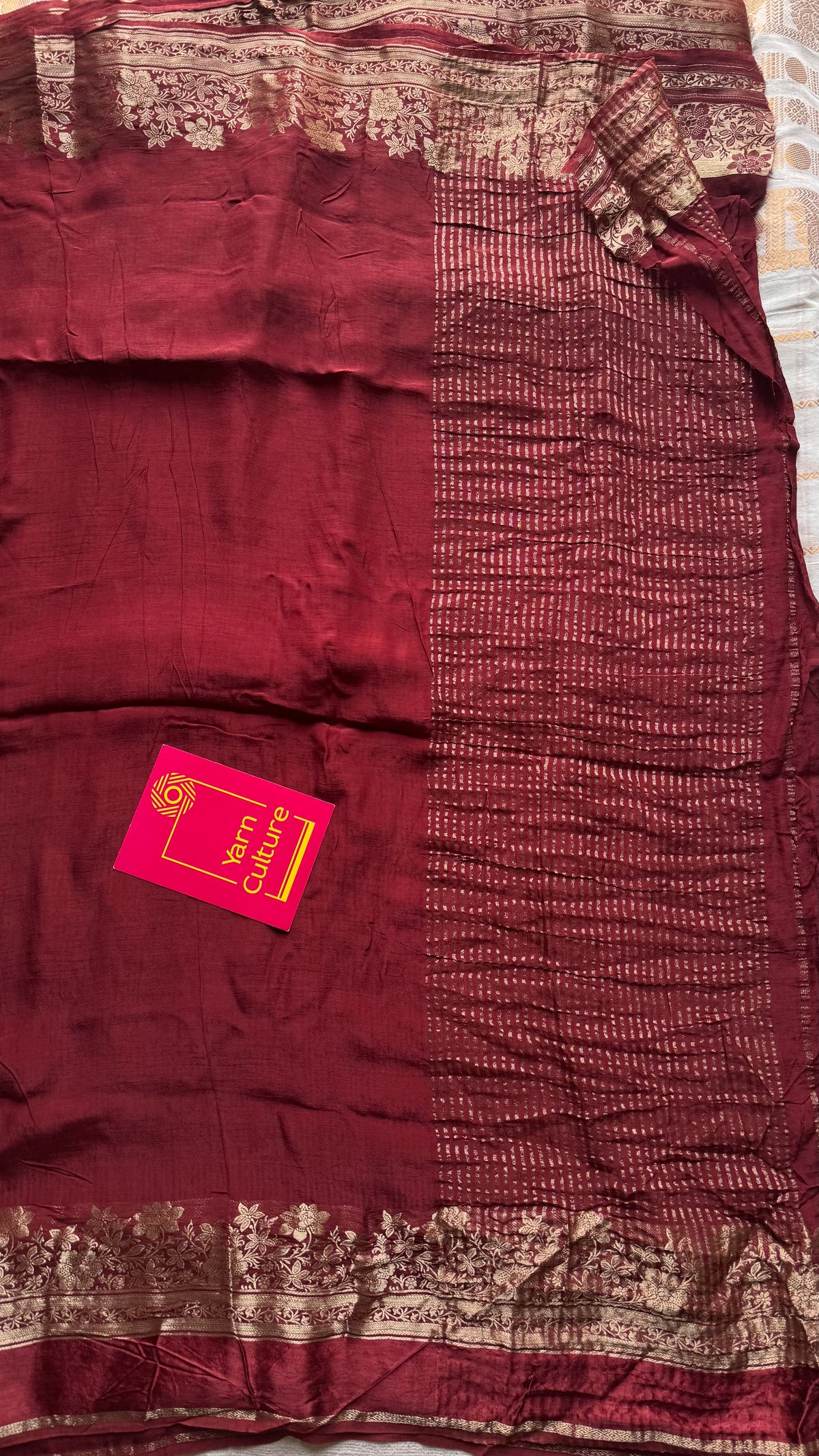 Maroon, semi crepe silk saree with antique gold floral border - YCLOKOC52